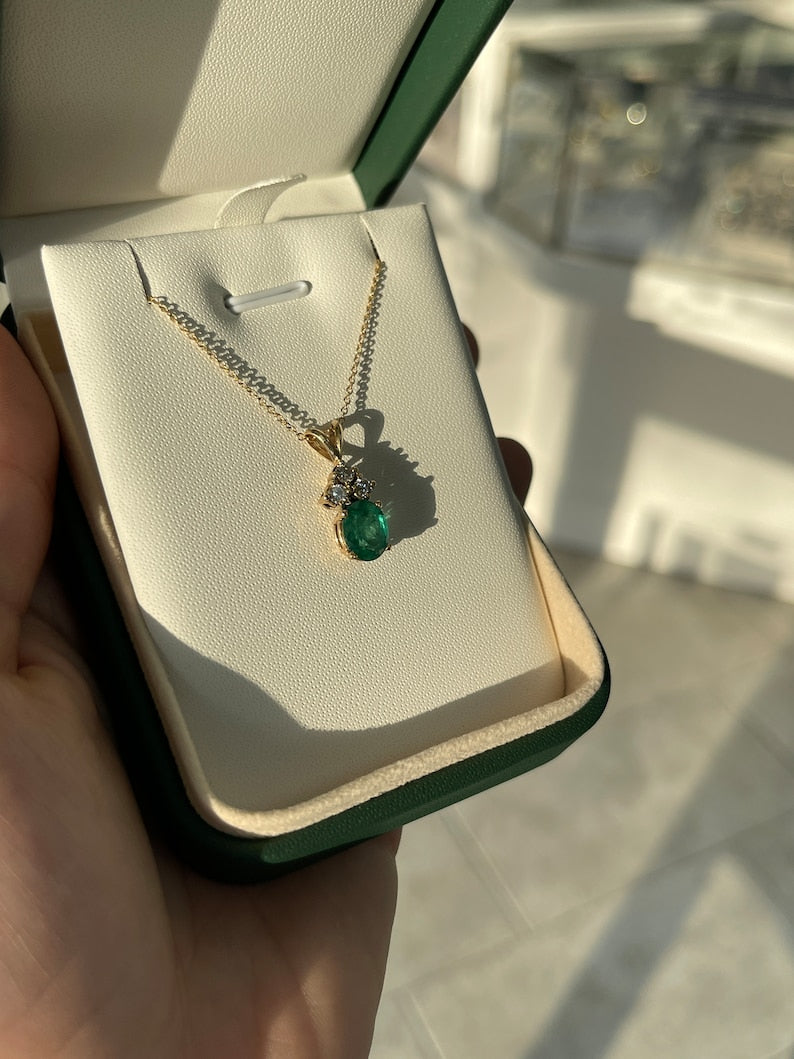 Rich Dark Green Oval Cut Emerald Pendant Necklace with 2.27 Carat Total Weight, 14K Split Bail, and Diamond Accent