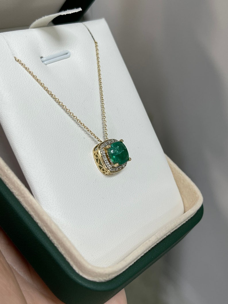 Elegant 14K Gold Pendant Featuring a 3.20tcw Cushion Shaped Emerald with Diamonds