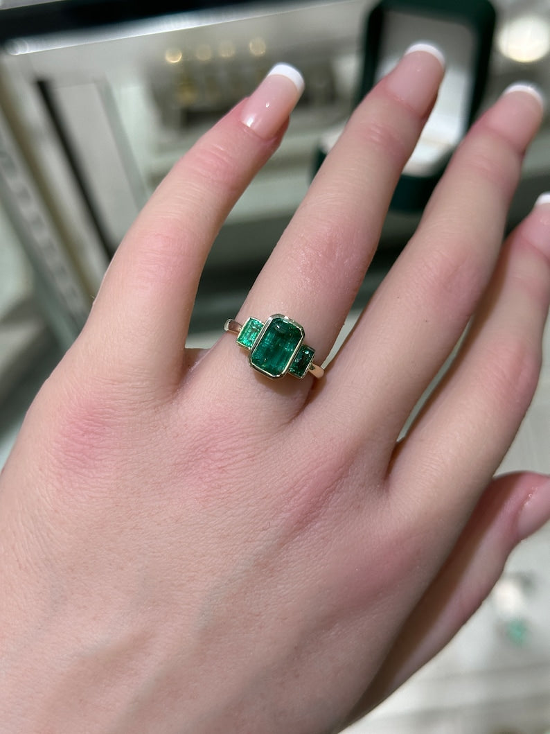 Captivating 14K Gold Ring Featuring 2.30 Total Carat Weight of Natural Emerald Cut Trilogy in Rich Dark Green
