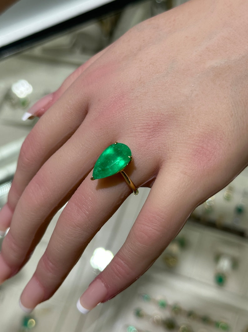 Right Hand 18K Gold Solitaire Ring Featuring a 6.28ct Rare Pear Cut Emerald