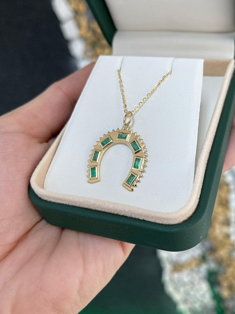 Baguette Emerald Horse Shoe Pendant Necklace in 14K Gold with a Total Carat Weight of 0.90