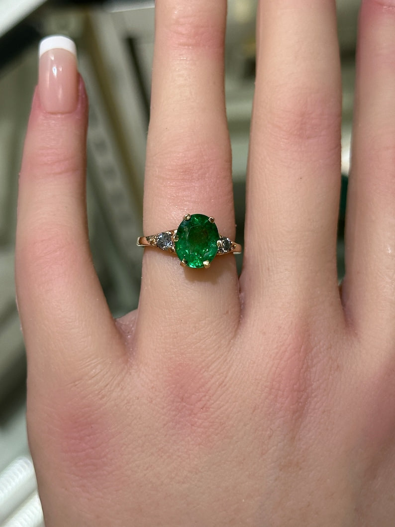 Captivating 3 Stone Ring in 14K Rose Gold, Highlighting 2.54tcw Oval Emerald & Round Cut Rich Green Diamonds