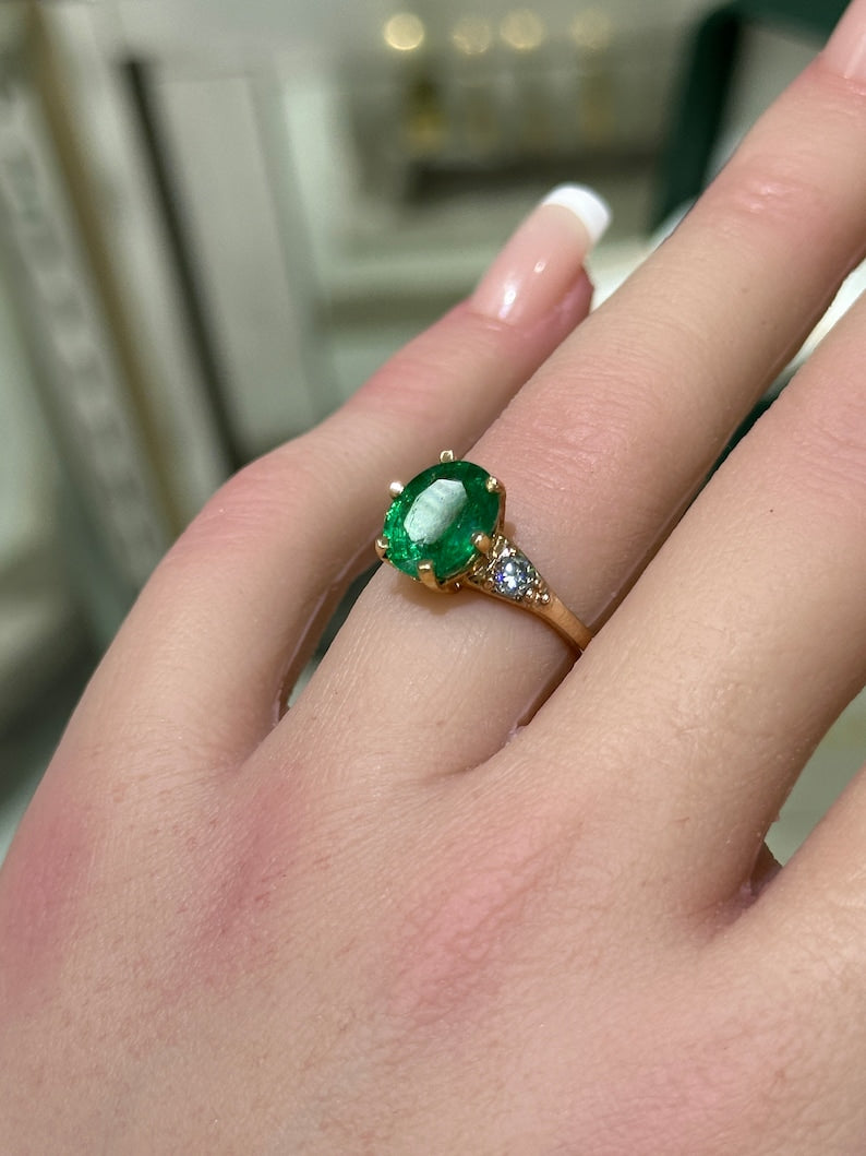 Exquisite 14K Rose Gold Ring Boasting 2.54 Total Carat Weight, Oval Emerald, and Round Cut Rich Green Diamonds in a 6-Prong Setting