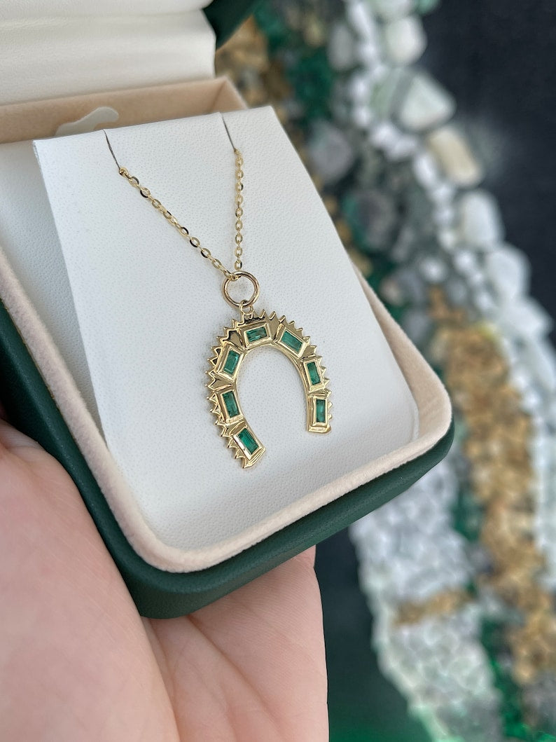 0.90 Carat Baguette Emeralds Set in a 14K Gold Horse Shoe Pendant Necklace