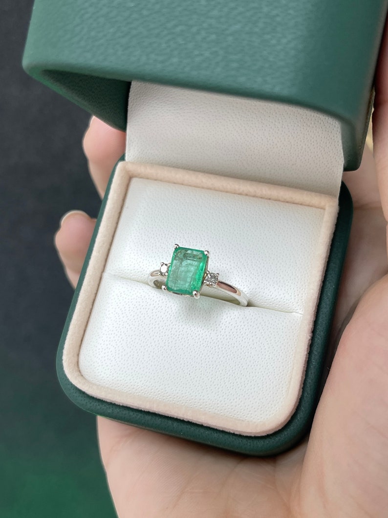 Sterling Silver Ring Embellished with 70tcw Medium Green Emerald-Cut Stone and Sparkling Diamond Accents