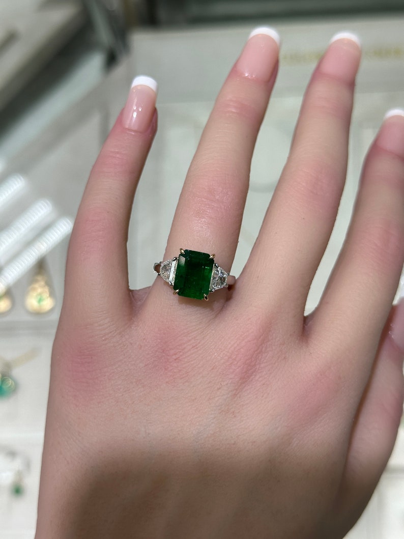 Elegant 4.79tcw Three-Stone Ring: Dark Green VVS2 Emerald and Diamonds Set in 18K Platinum