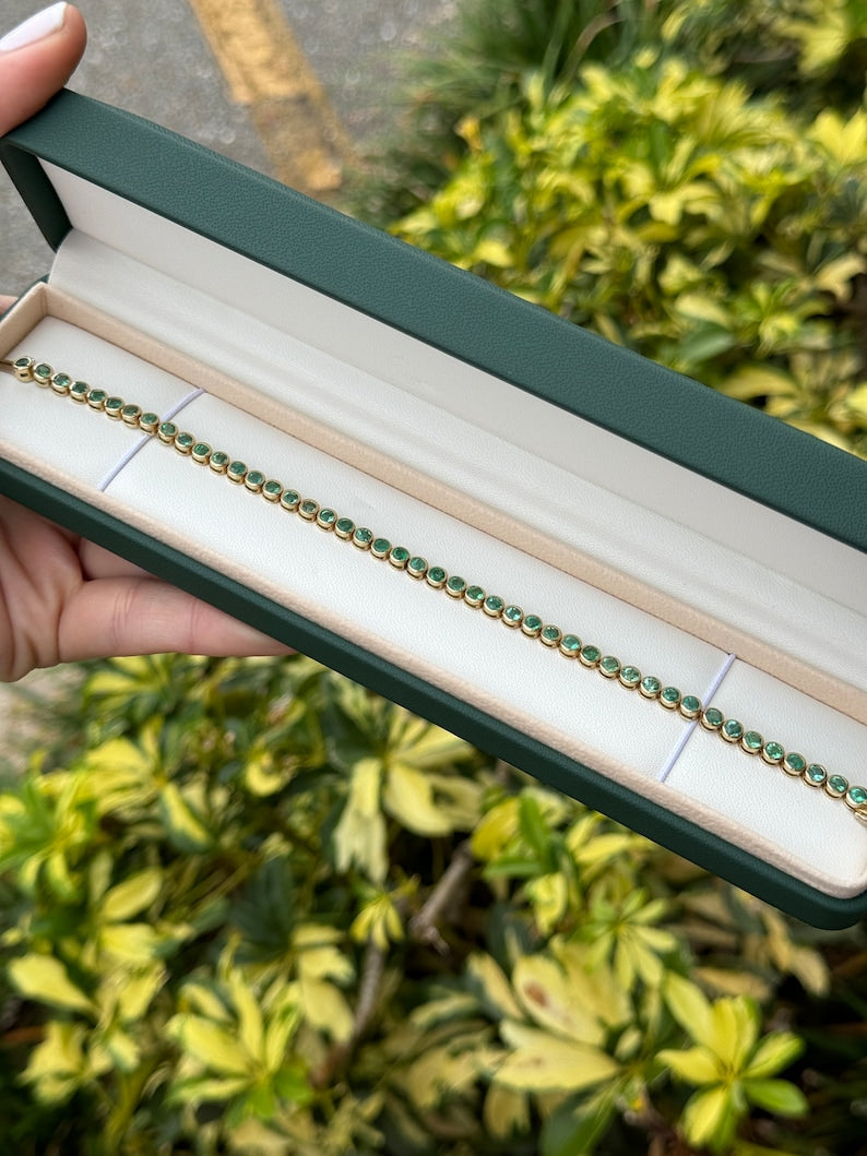 Exquisite Unisex Tennis Bracelet featuring 9.40tcw Round Cut Emeralds