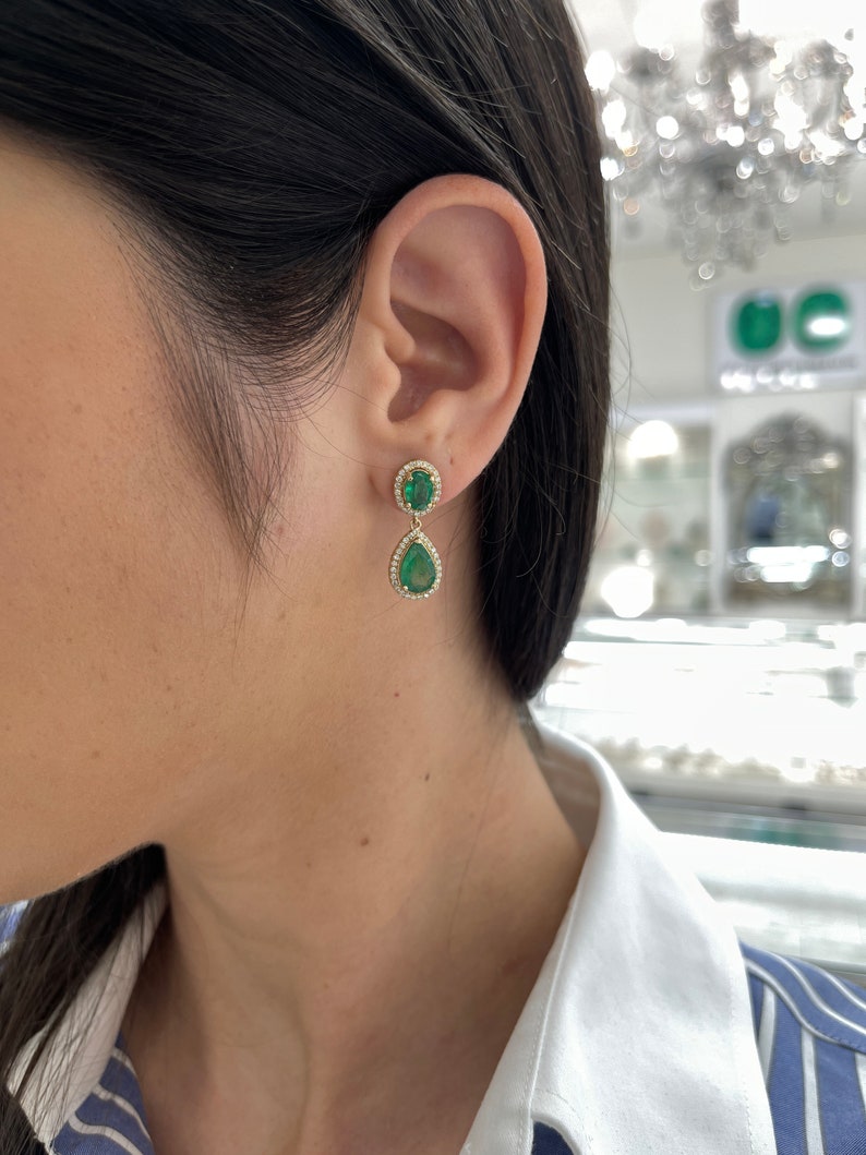 Chic 14K Gold Dangle Earrings Adorned with 5.40tcw of Oval and Pear Cut Emeralds and Diamonds