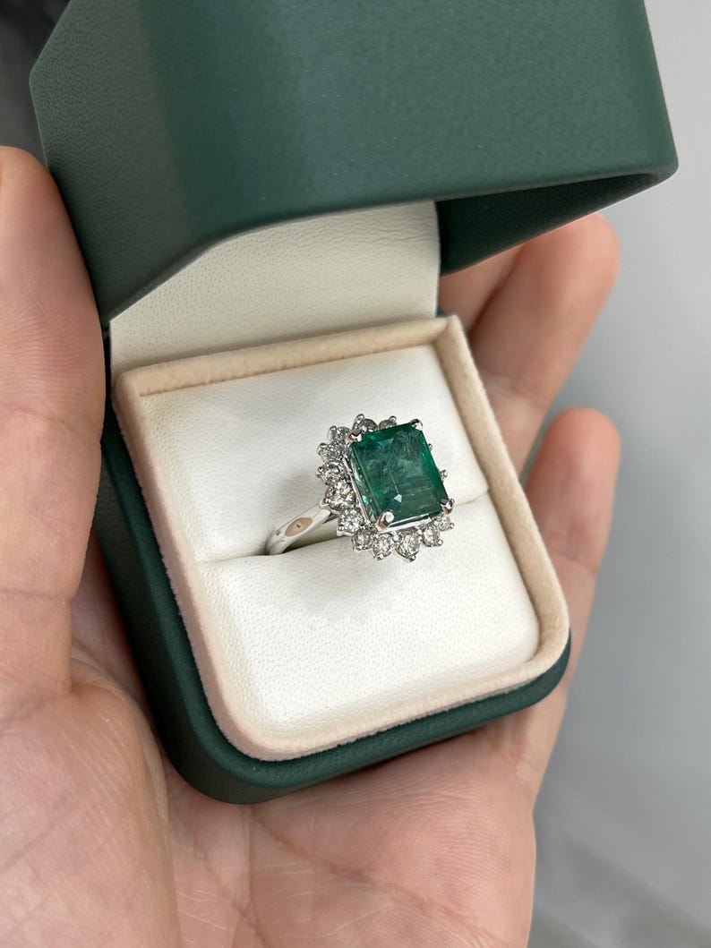 Elegant 6.64tcw Deep Green Emerald Ring with a Sparkling Diamond Halo in 14K