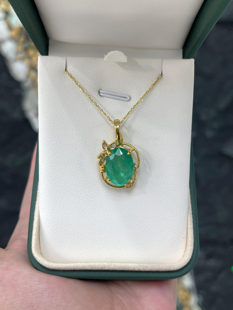 Elegant 7.97tcw Medium Green Oval Colombian Emerald Pendant with Diamond Floral Design in 14K Gold