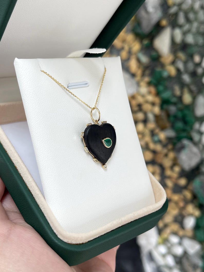 0.84tcw Pear Cut Emerald Pendant Set in 14K Gold and Heart-Shaped Ebony Wood