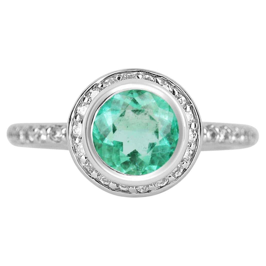 Round 1.60 Carat Colombian emerald diamond halo engagement ring in 14K gold by JR Colombian Emeralds.