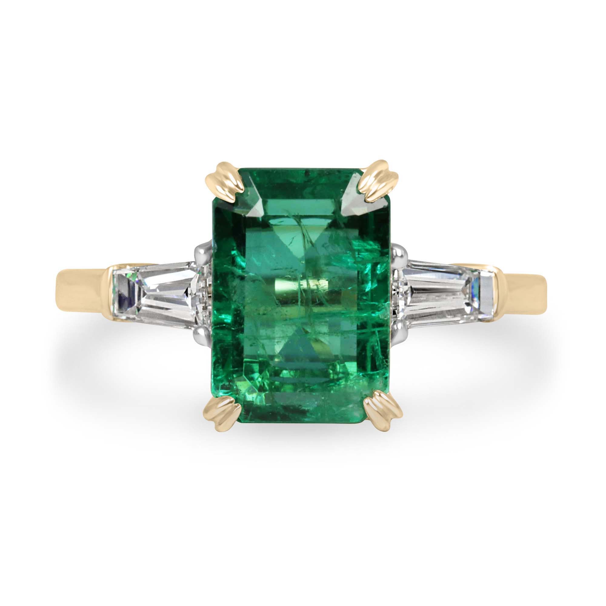 14K two-tone natural emerald cut emerald and baguette diamond three-stone engagement ring by JR Colombian Emeralds, showcasing elegant jewelry design.