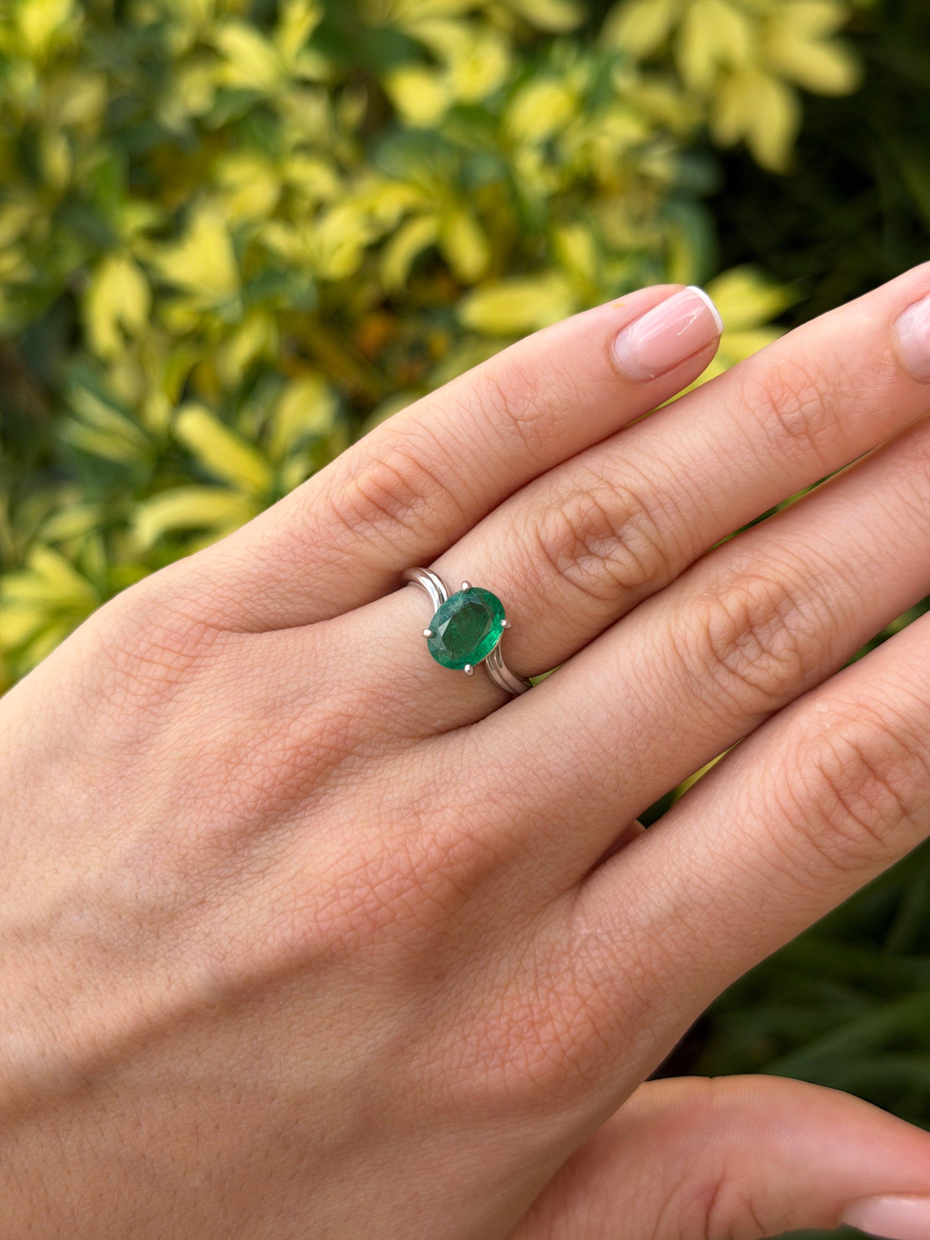 Natural 2.05ct oval emerald solitaire wave ring in 14K white gold by JR Colombian Emeralds, showcasing the elegant gemstone setting.