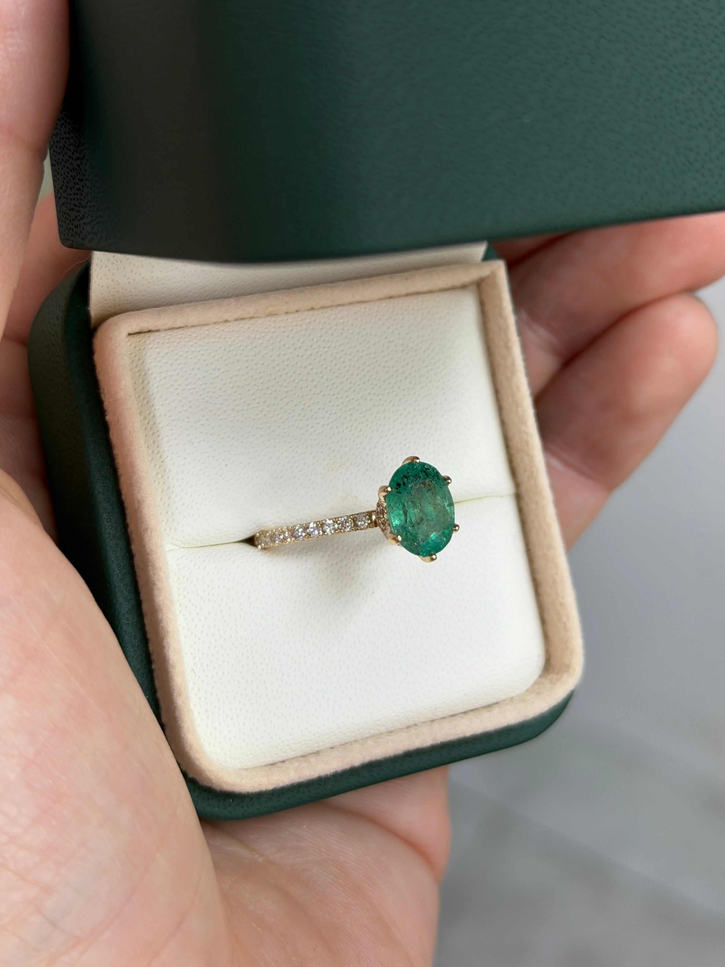 Natural oval freckled emerald with lab diamond accents engagement ring in 14K gold by JR Colombian Emeralds.