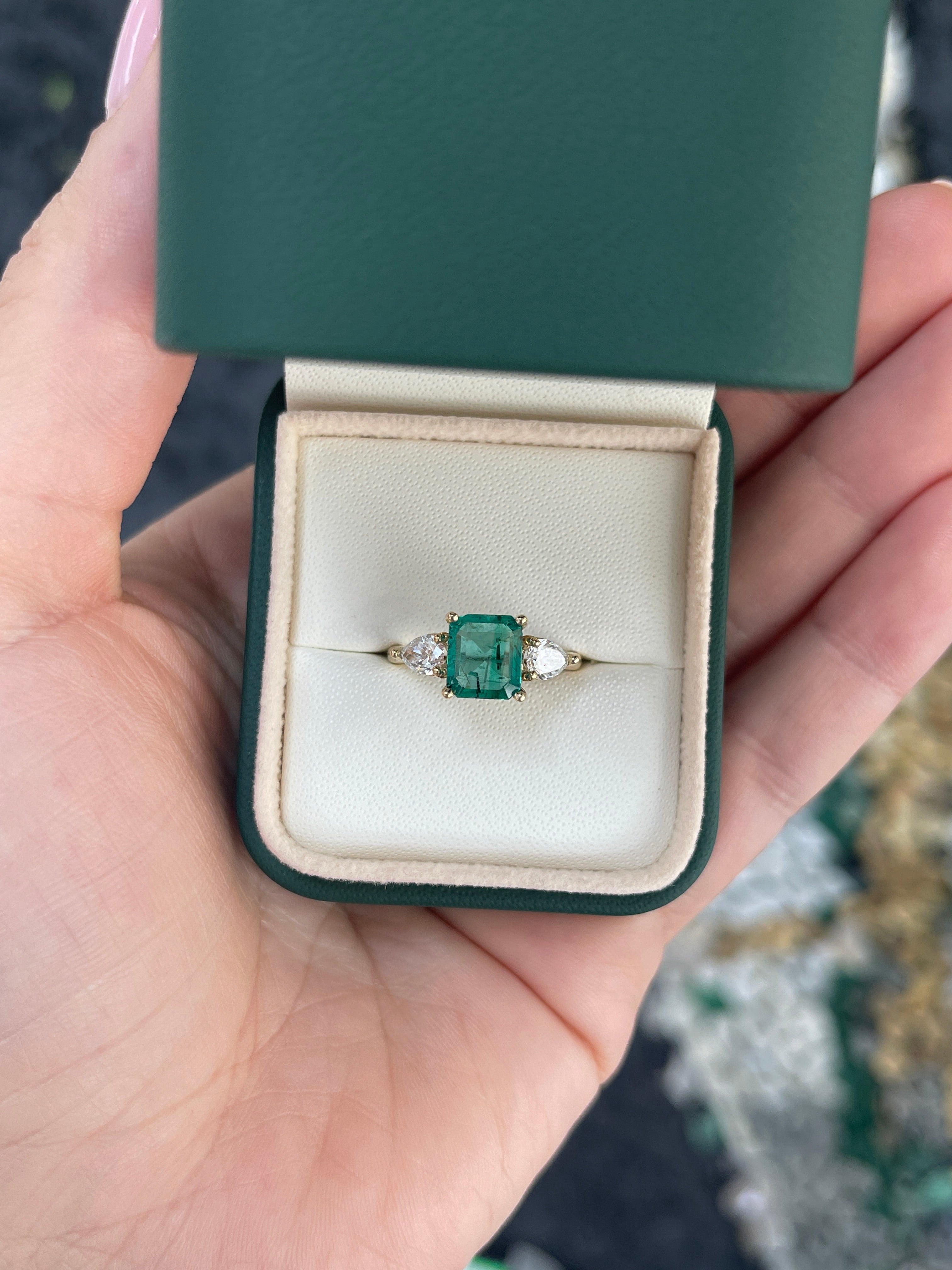 14K gold three-stone engagement ring featuring a freckled emerald and lab-created pear-shaped diamonds, 2.55tcw, by JR Colombian Emeralds.