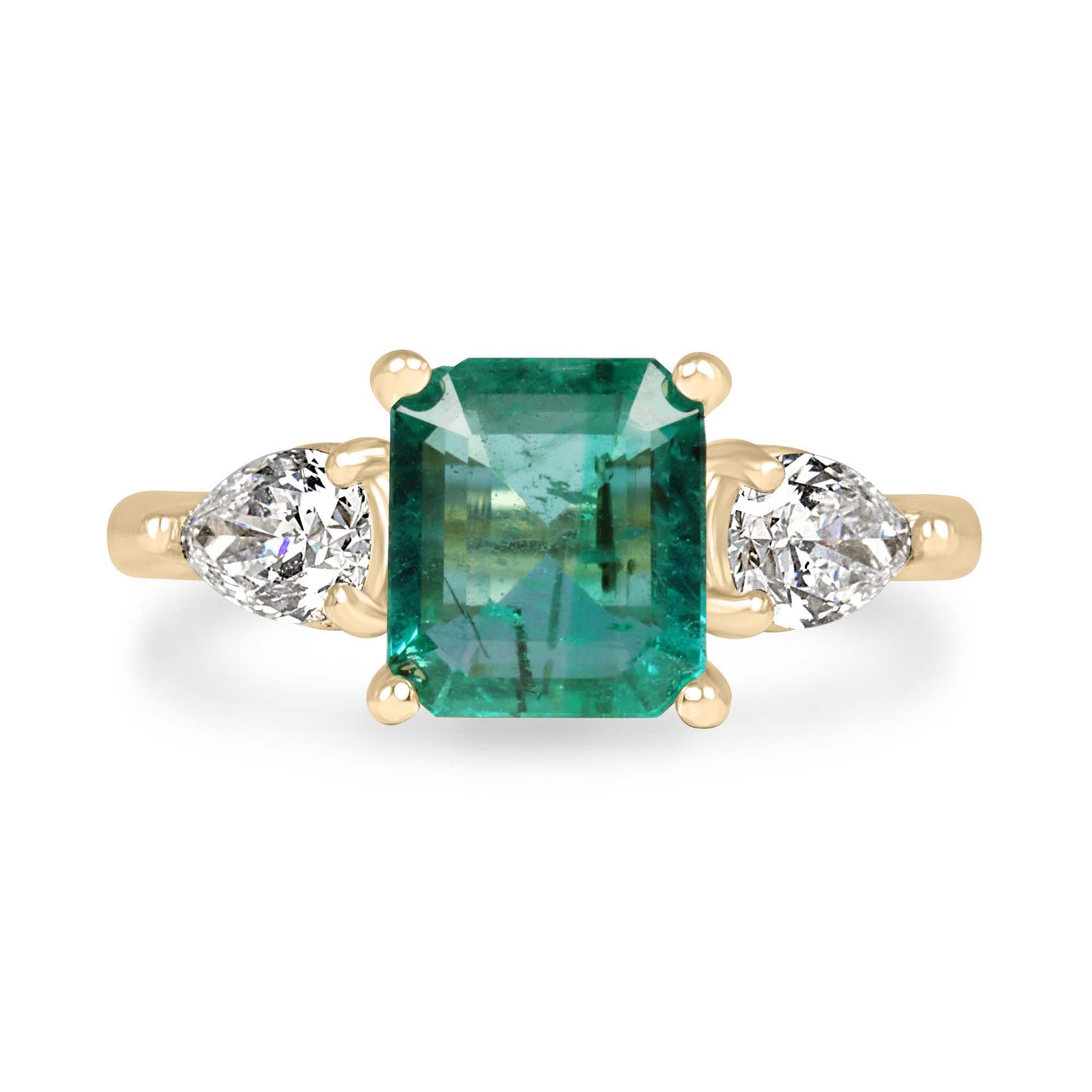 14K gold engagement ring with a natural freckled emerald and lab diamond pear side stones, three-stone design by JR Colombian Emeralds.