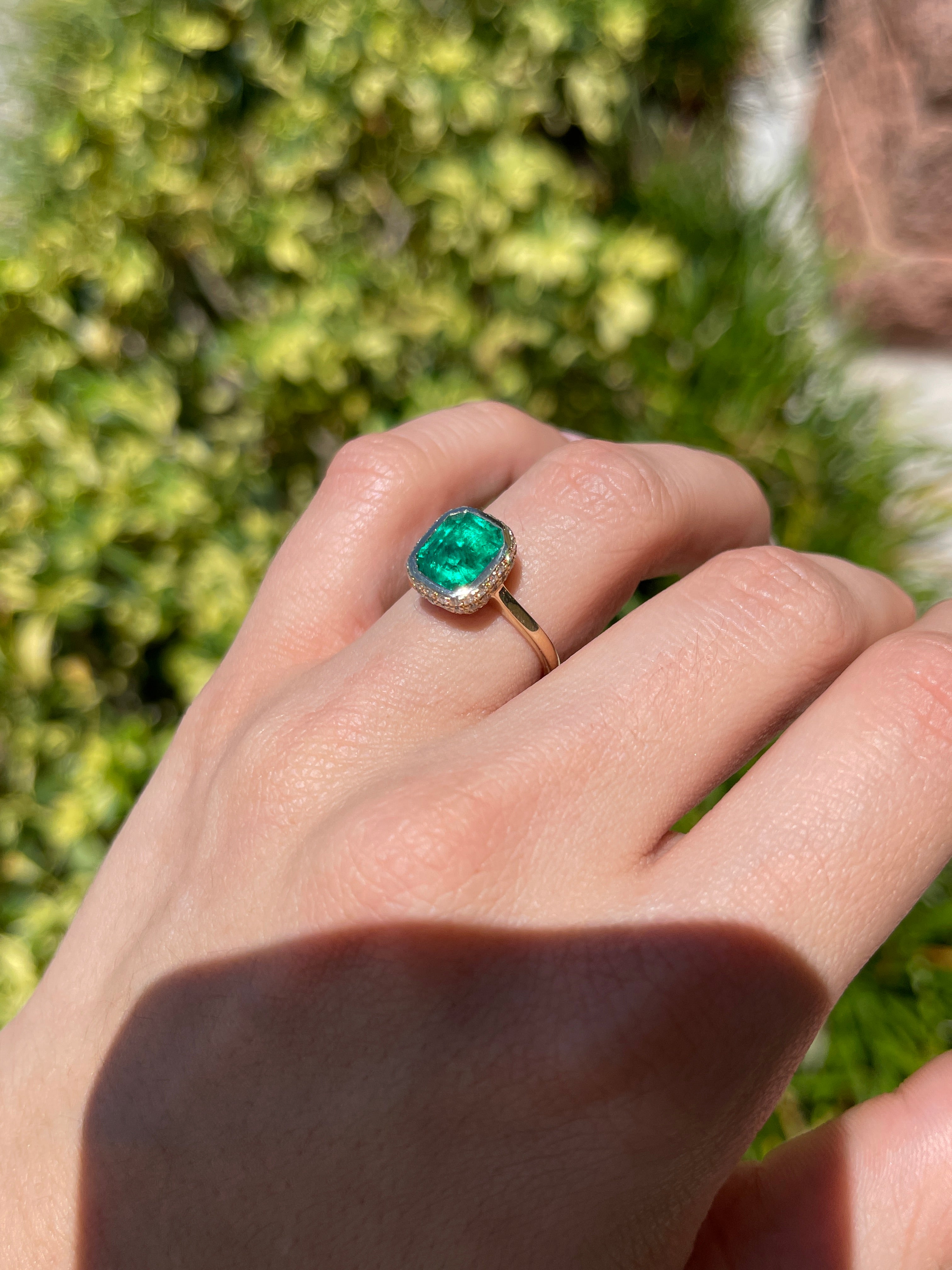 14K Colombian Emerald and diamond pave halo statement ring with bezel setting, featuring a 3.19tcw emerald by JR Colombian Emeralds.