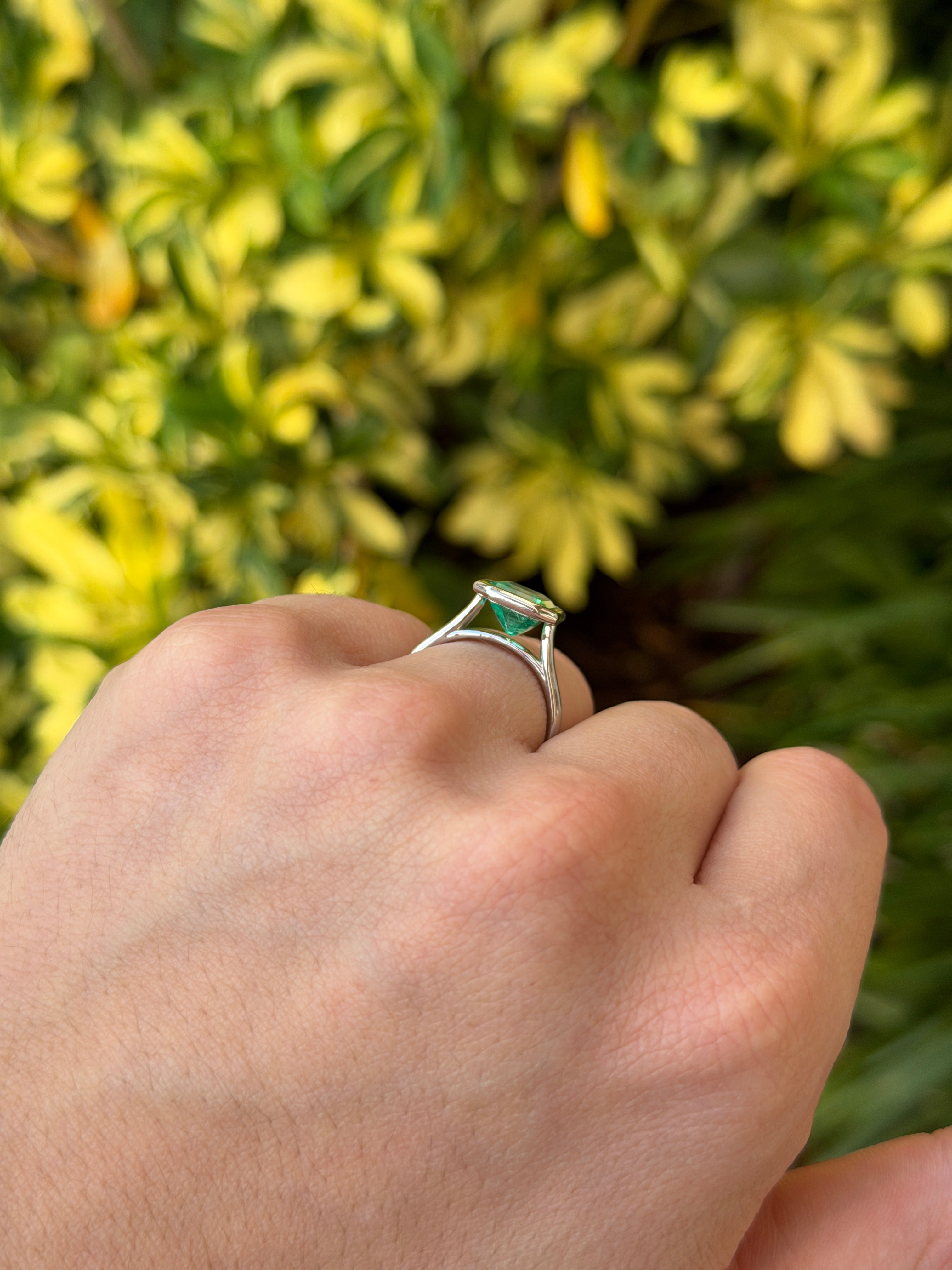 18K white gold ring featuring a 3.46ct bezel-set Colombian emerald solitaire with vibrant green Chivor emerald from JR Colombian Emeralds