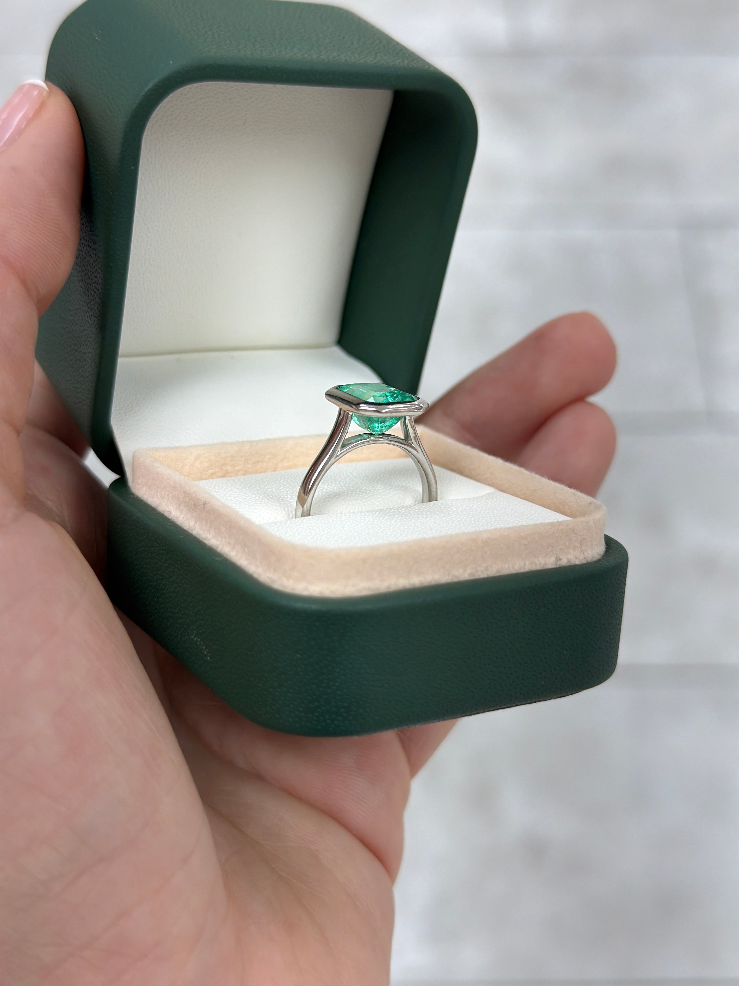 18K white gold ring with a 3.46ct bezel-set Colombian emerald solitaire, featuring vibrant green Chivor emerald by JR Colombian Emeralds.