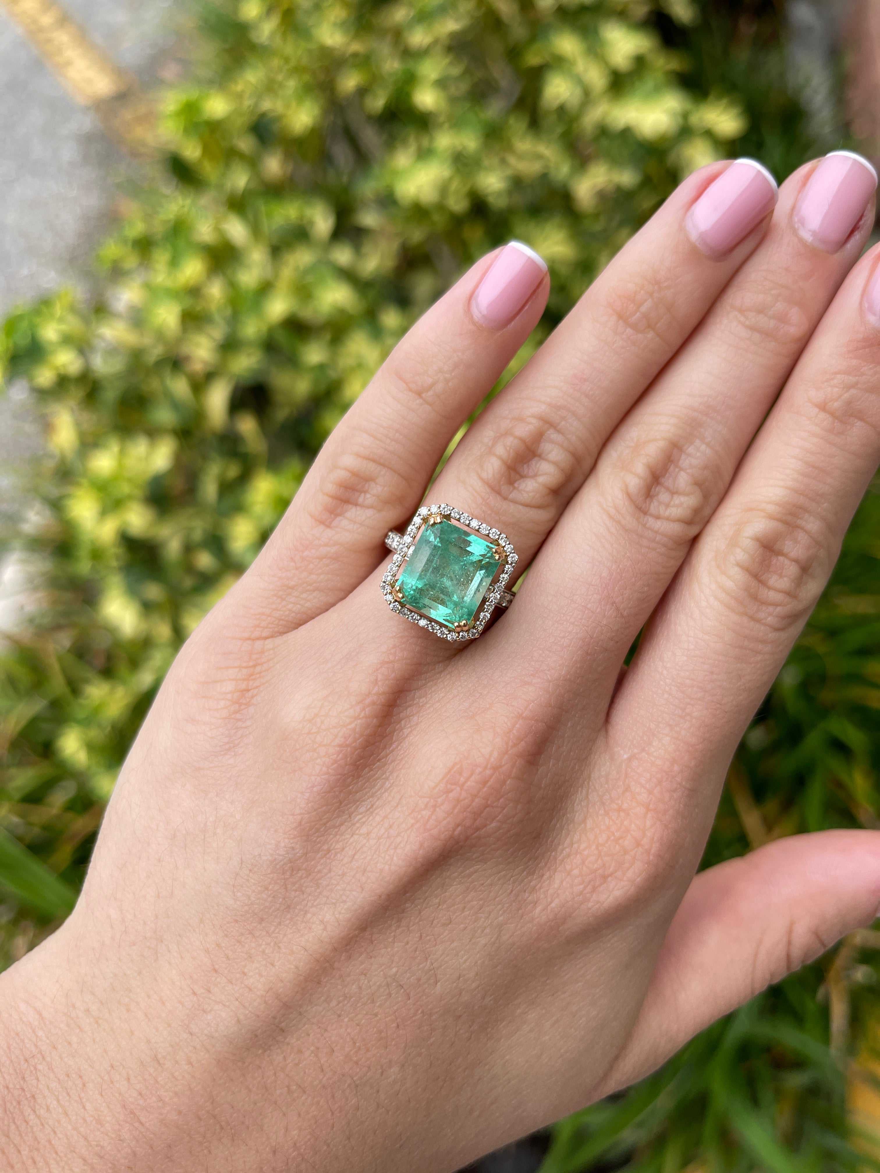 Large Colombian Emerald Asscher cut engagement ring with diamond halo, 18K gold, featuring a 7.82 carat natural emerald.