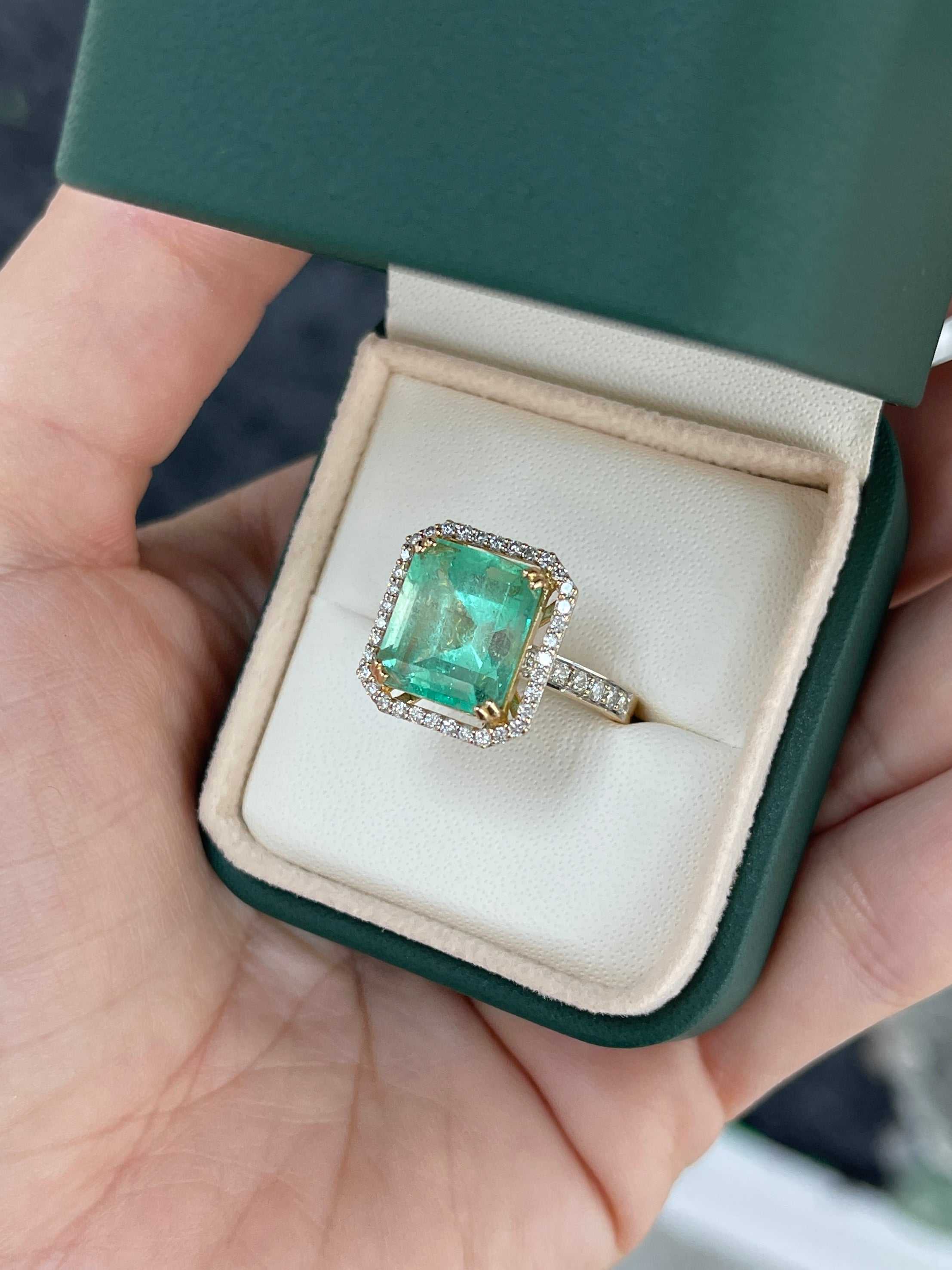 Large Colombian emerald Asscher cut engagement ring with diamond halo, set in 18K gold, featuring a 7.82tcw natural emerald from JR Colombian Emeralds