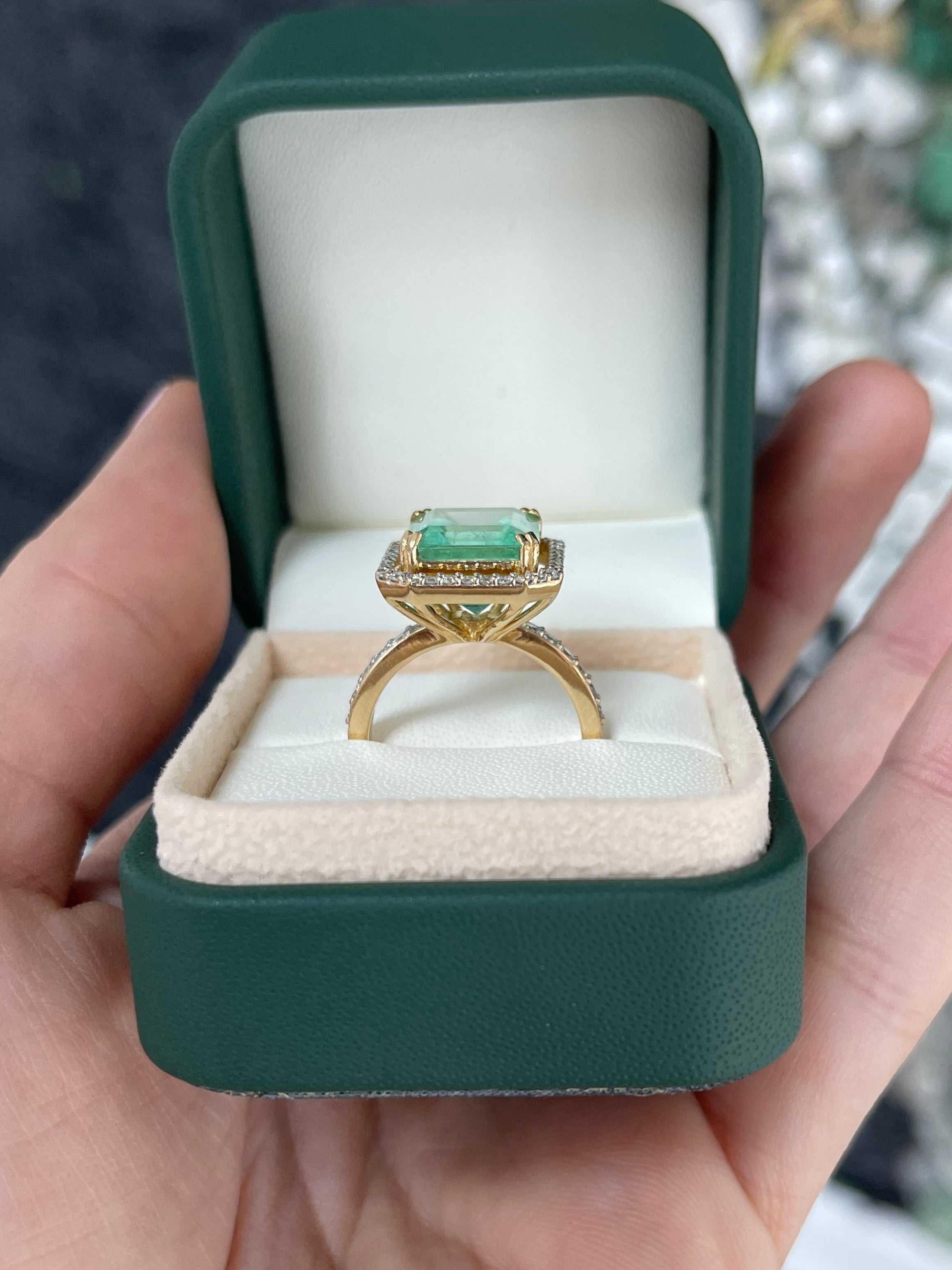Large Colombian emerald Asscher cut center stone with diamond halo on 18K band, engagement ring by JR Colombian Emeralds.
