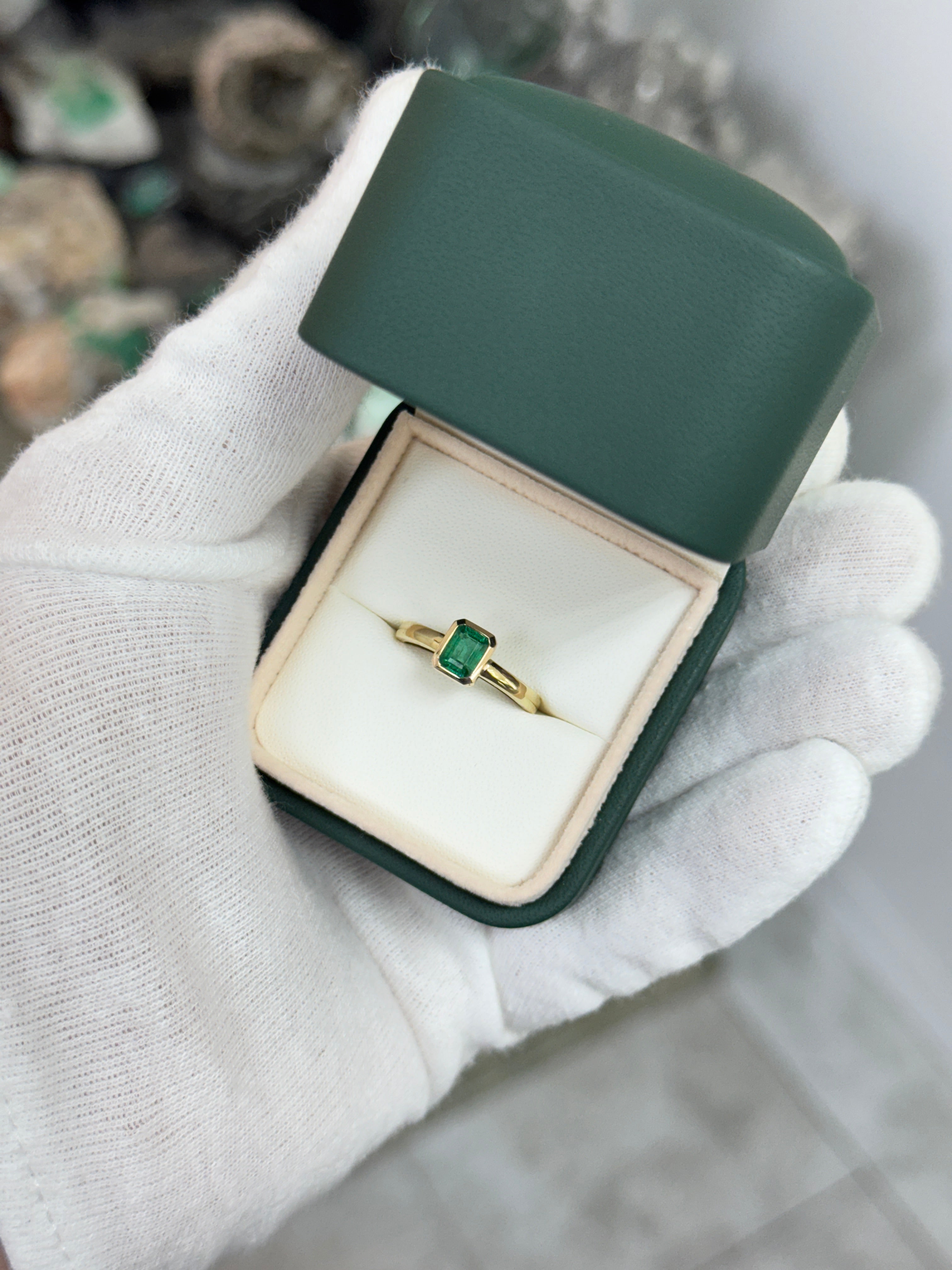 14K gold ladies ring with a 0.90ct bezel set natural emerald by JR Colombian Emeralds, showcasing a classic, elegant design.