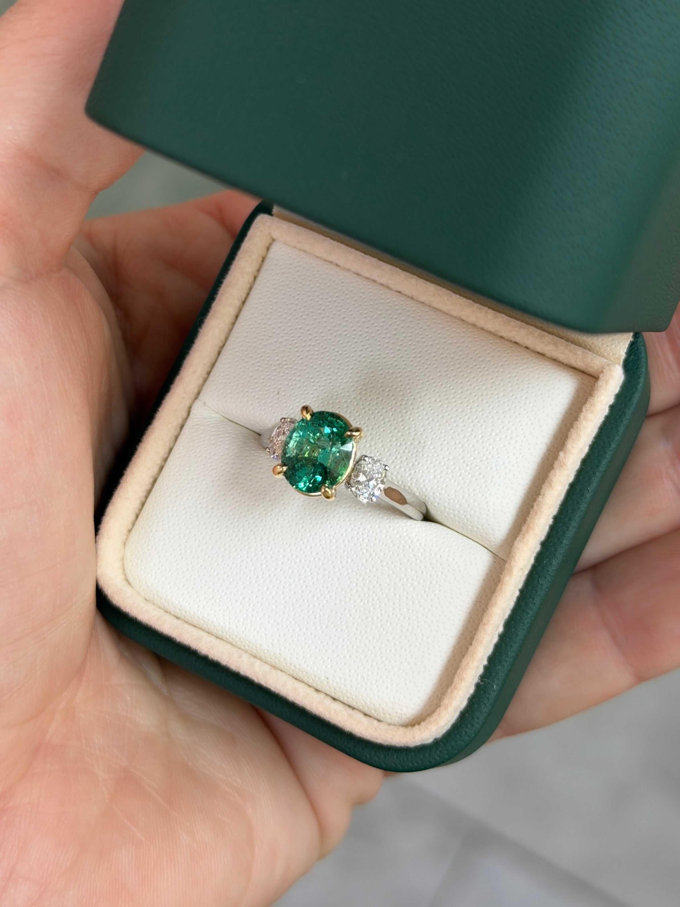 JR Colombian Emeralds 2.19tcw three-stone engagement ring featuring vibrant oval emerald and lab diamond accents in 14K platinum