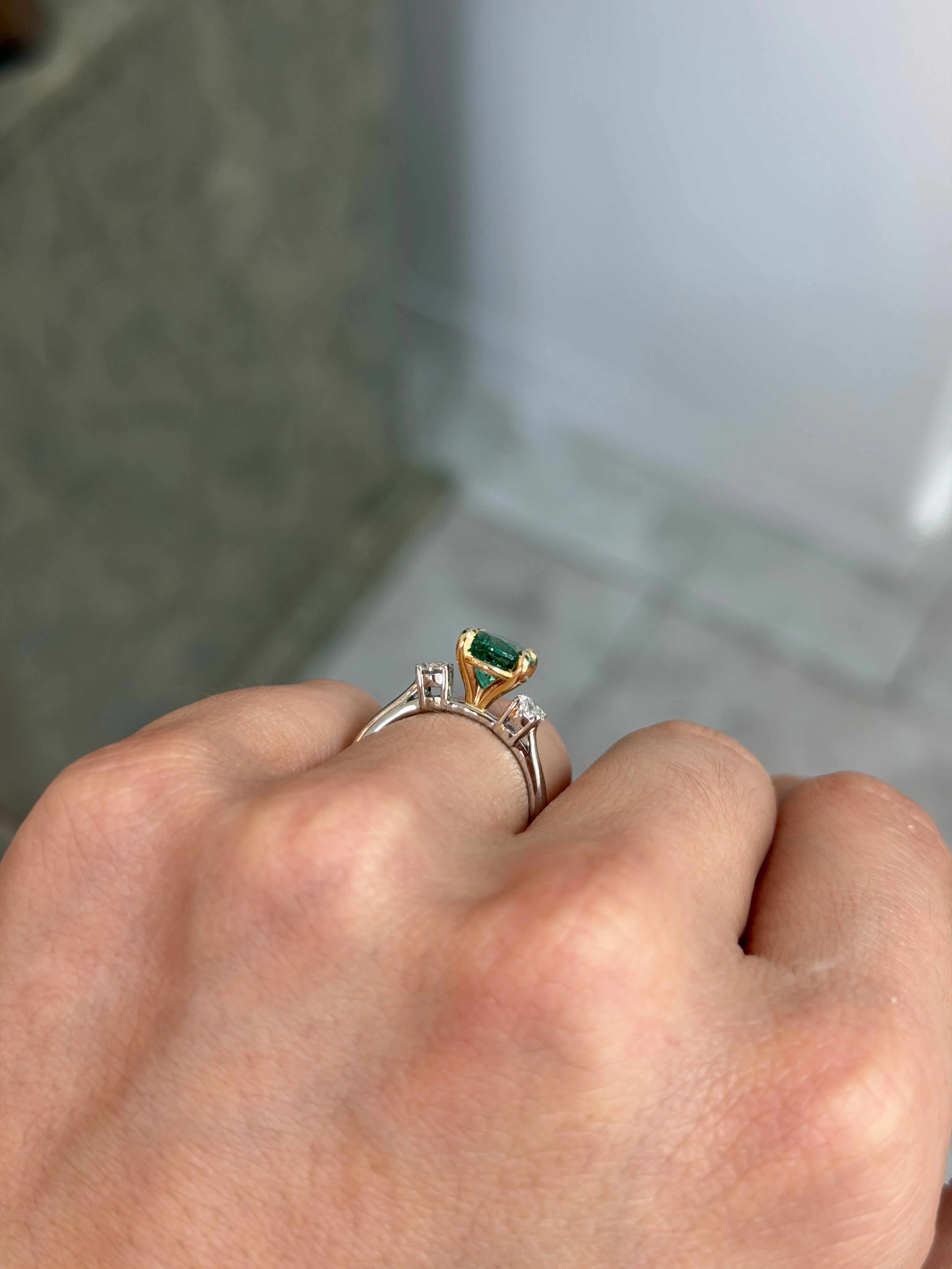 Vibrant oval emerald and lab diamond three-stone engagement ring in 14K platinum by JR Colombian Emeralds.