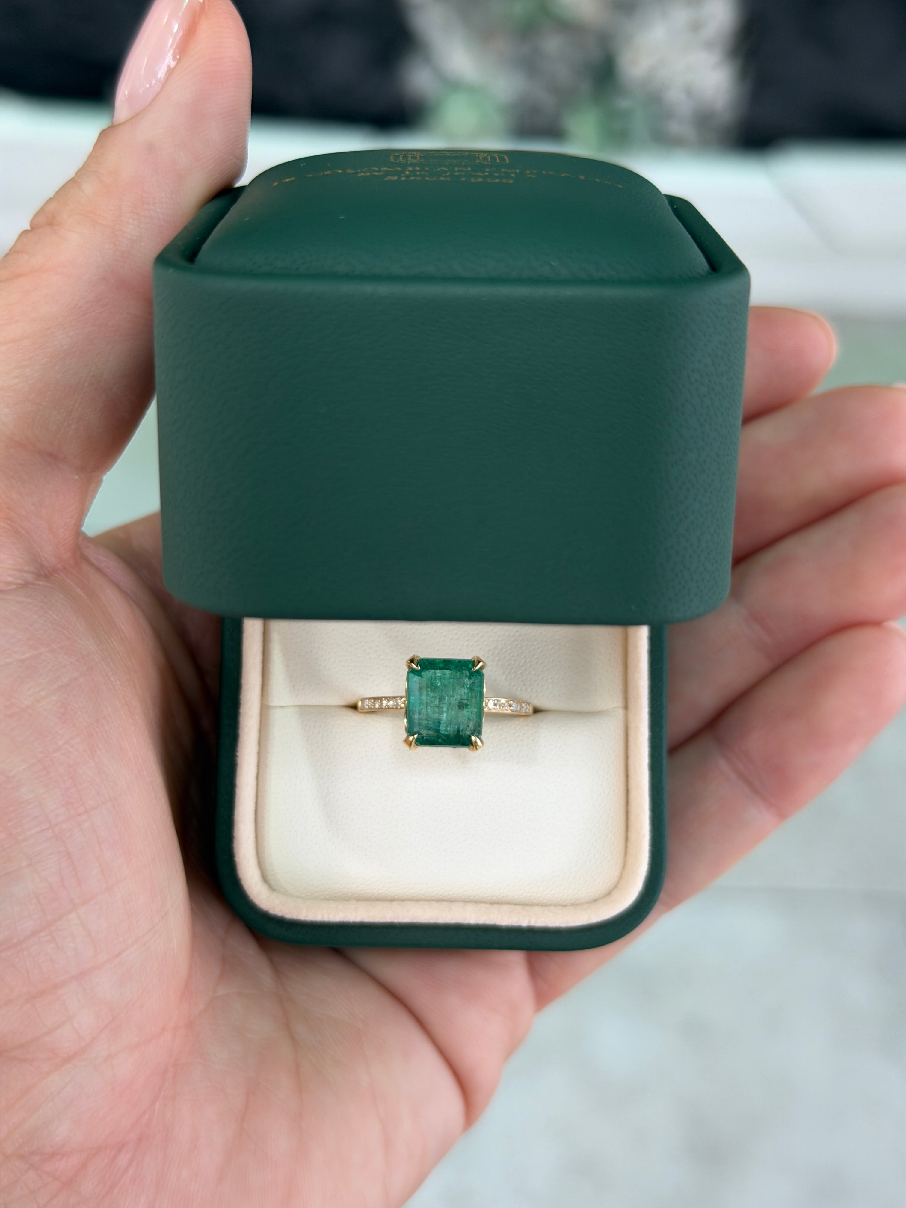 14K gold engagement ring with 3.50tcw natural emerald center stone, diamond halo, and detailed shank by JR Colombian Emeralds.
