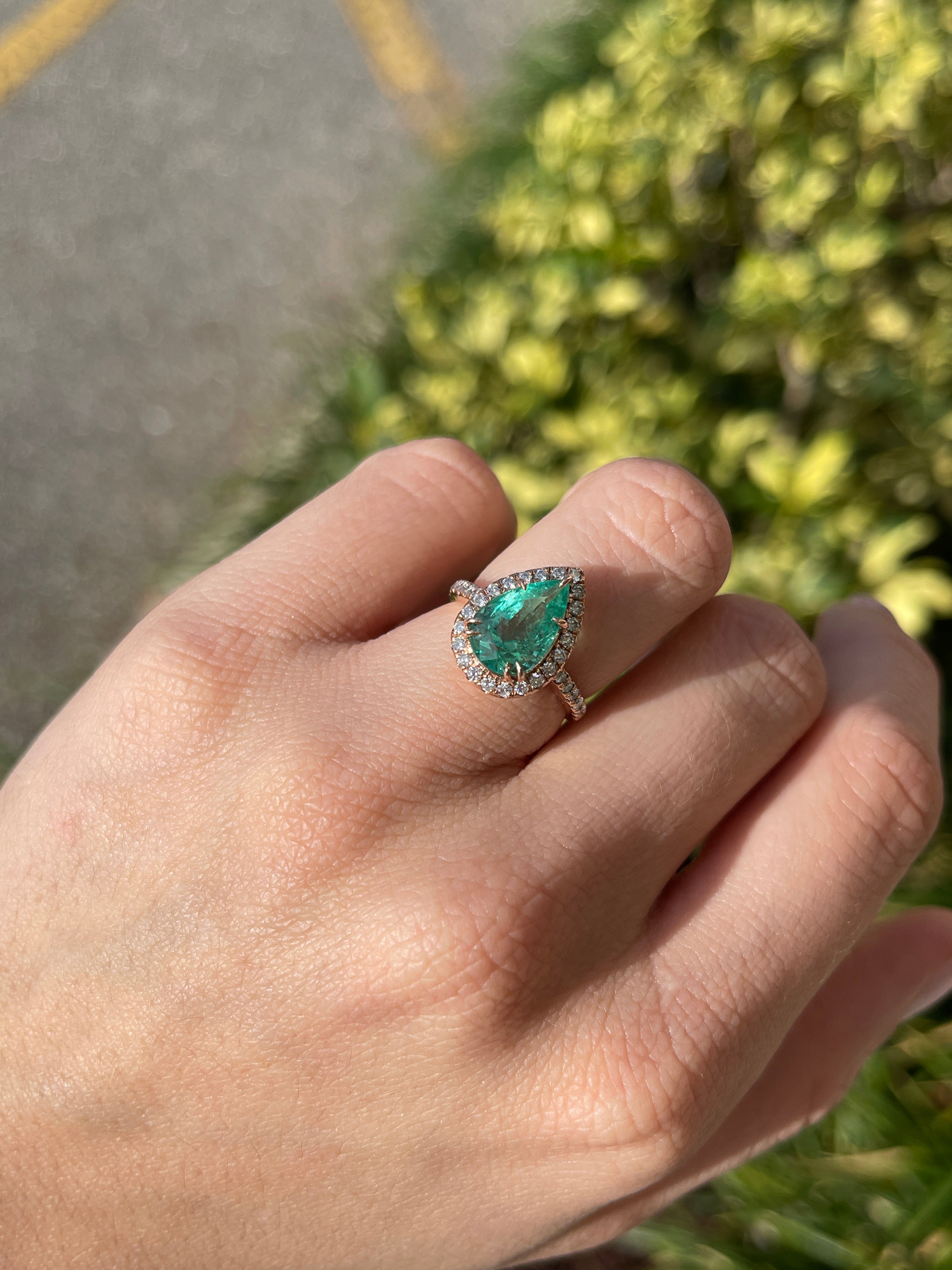 14K rose gold engagement ring with 3.44tcw pear emerald center stone and diamond halo from JR Colombian Emeralds.