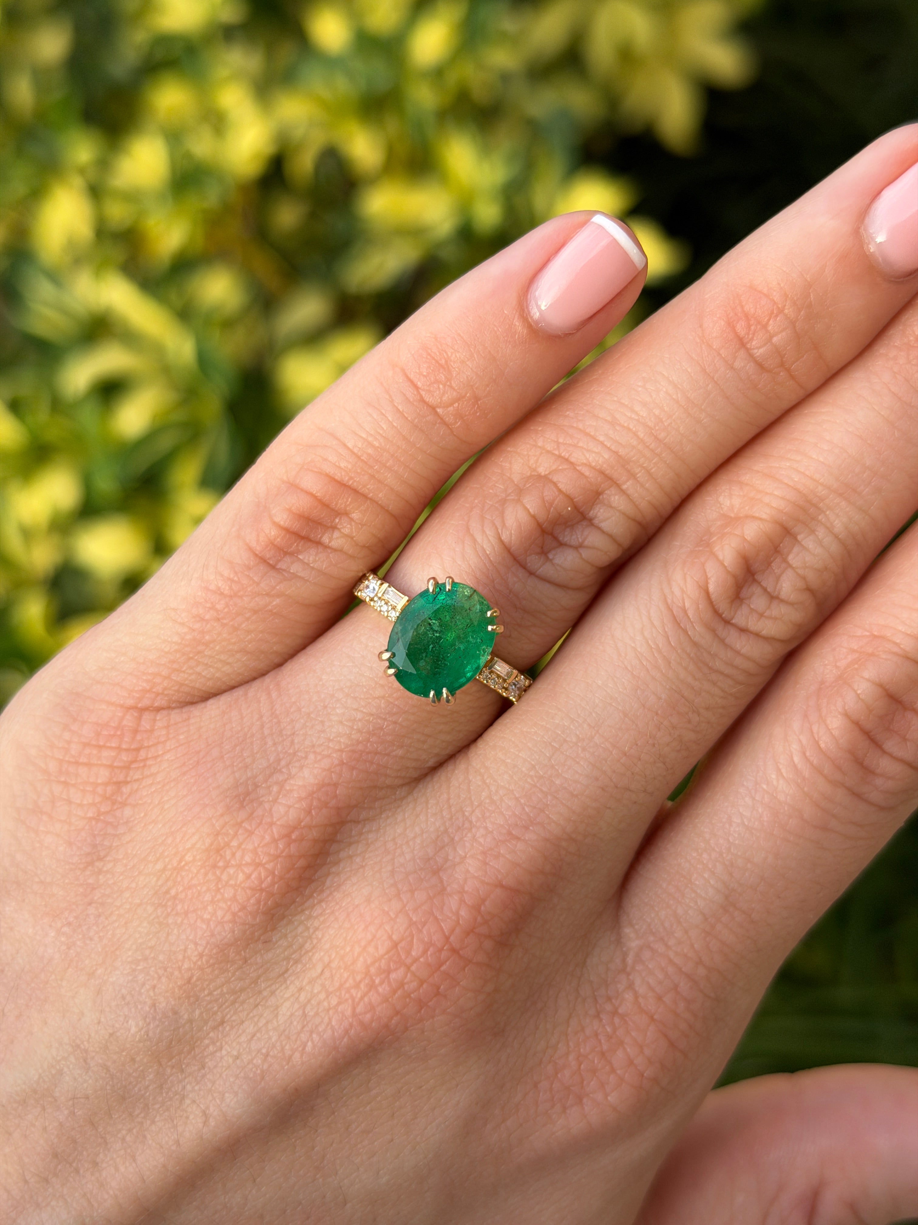 Natural oval emerald and lab diamond accented band in 14K gold with 4.35tcw from JR Colombian Emeralds.