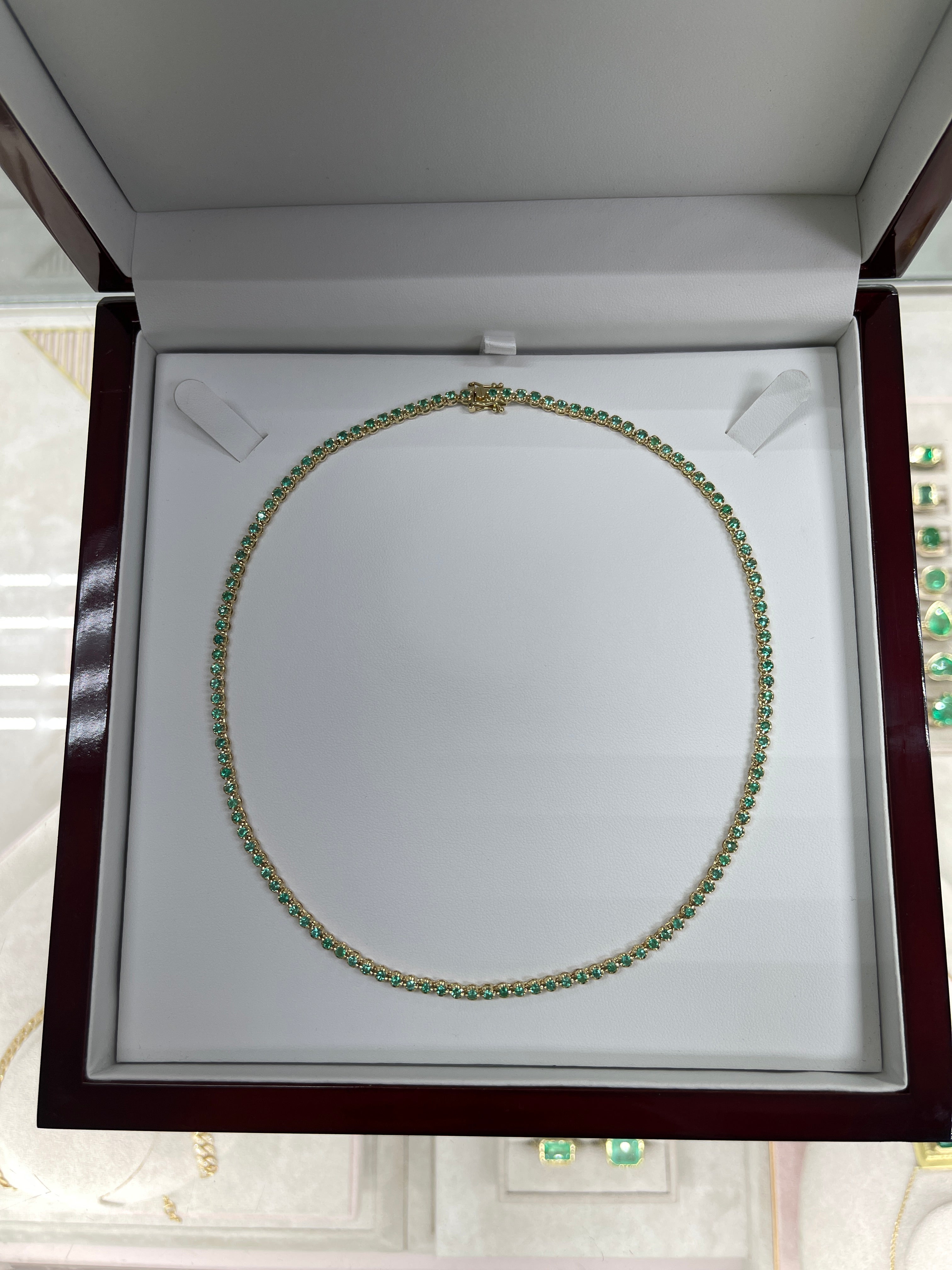 14K gold tennis necklace with round green emeralds totaling 8.20 carats, 17-inch length by JR Colombian Emeralds.
