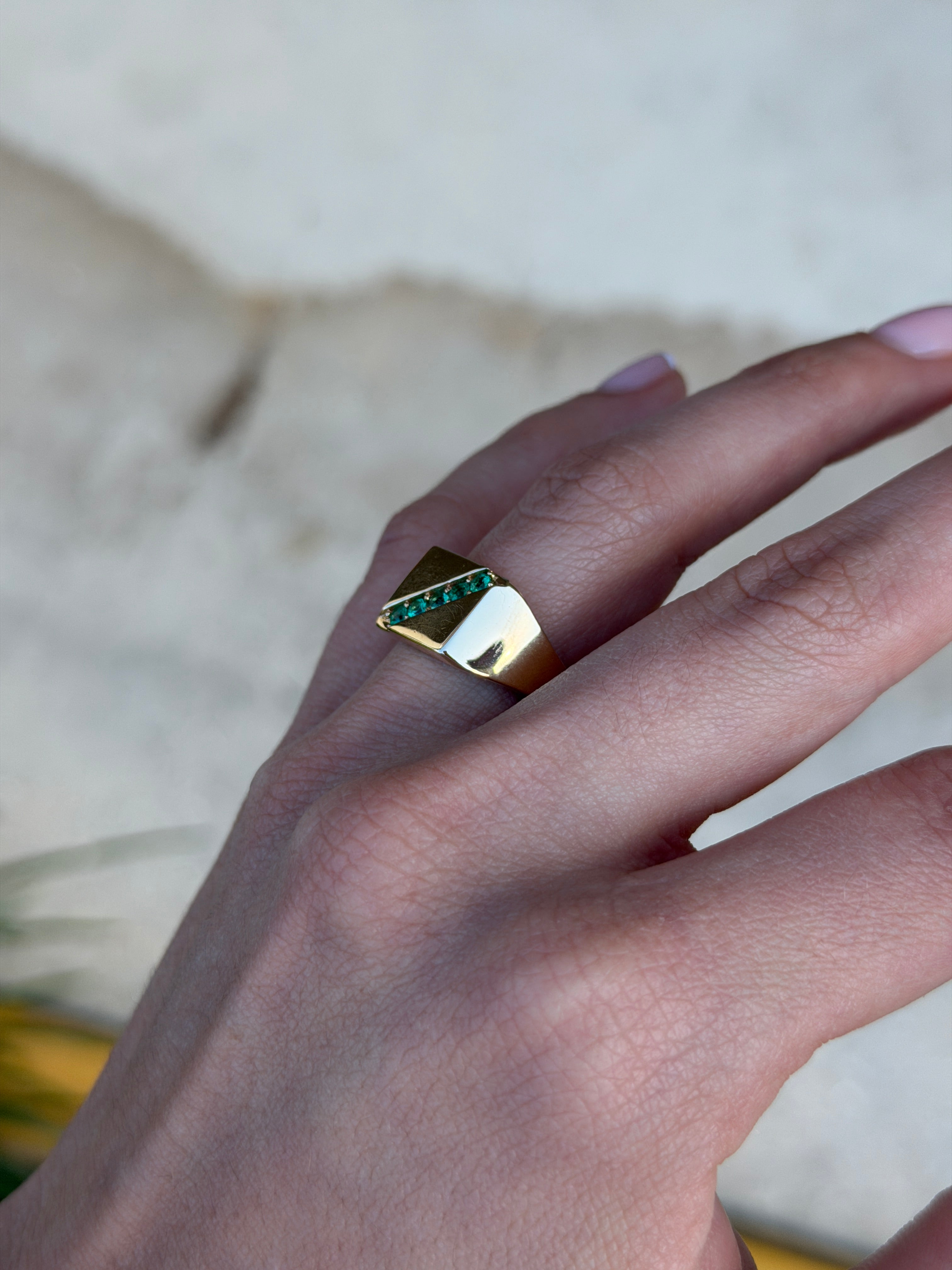 14K gold men's signet ring with round emeralds and channel setting, featuring 0.35tcw of Colombian emeralds from JR Colombian Emeralds.