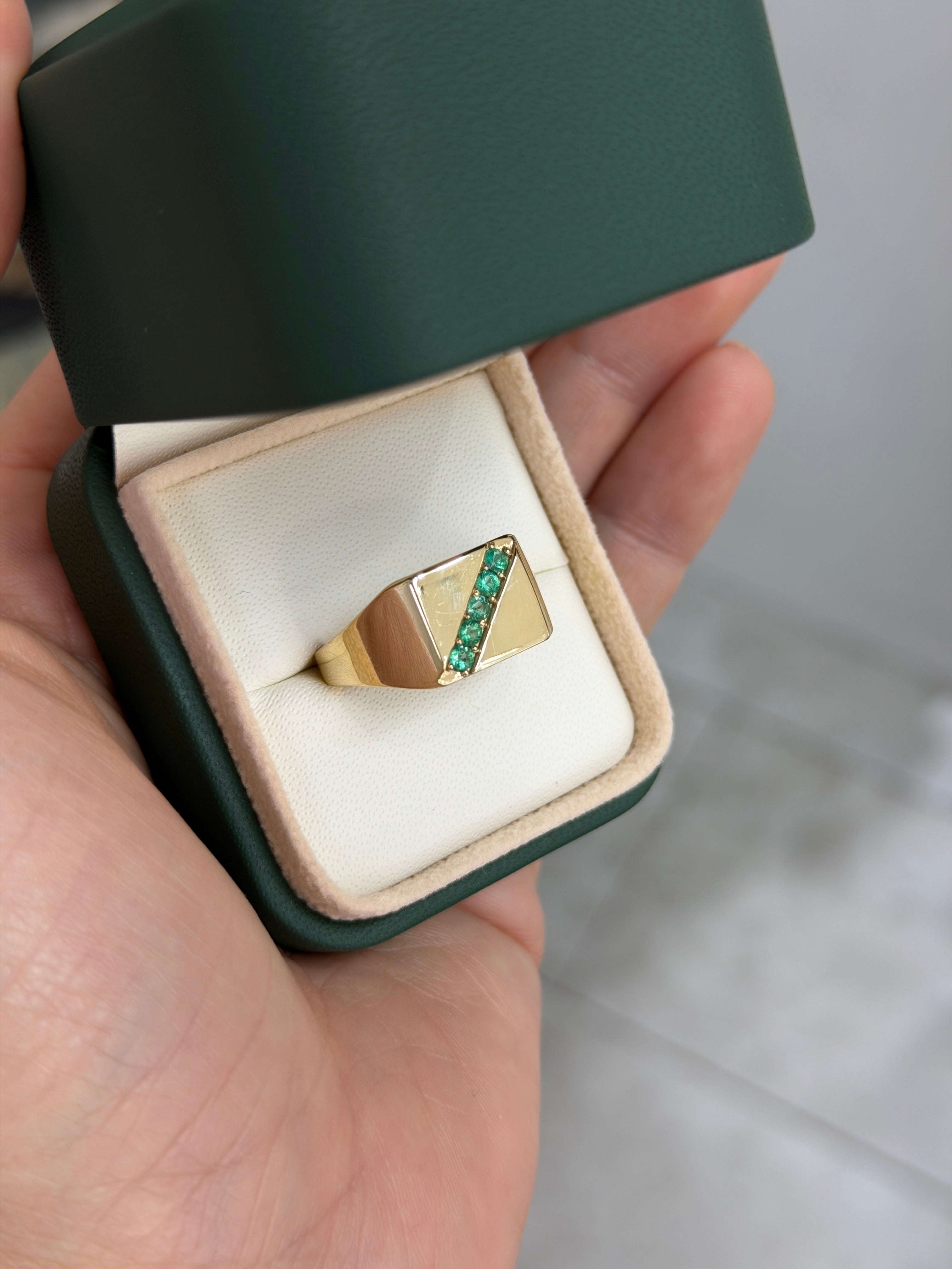 14K gold men's signet ring with round emeralds and channel setting, featuring 0.35 total carats from JR Colombian Emeralds.