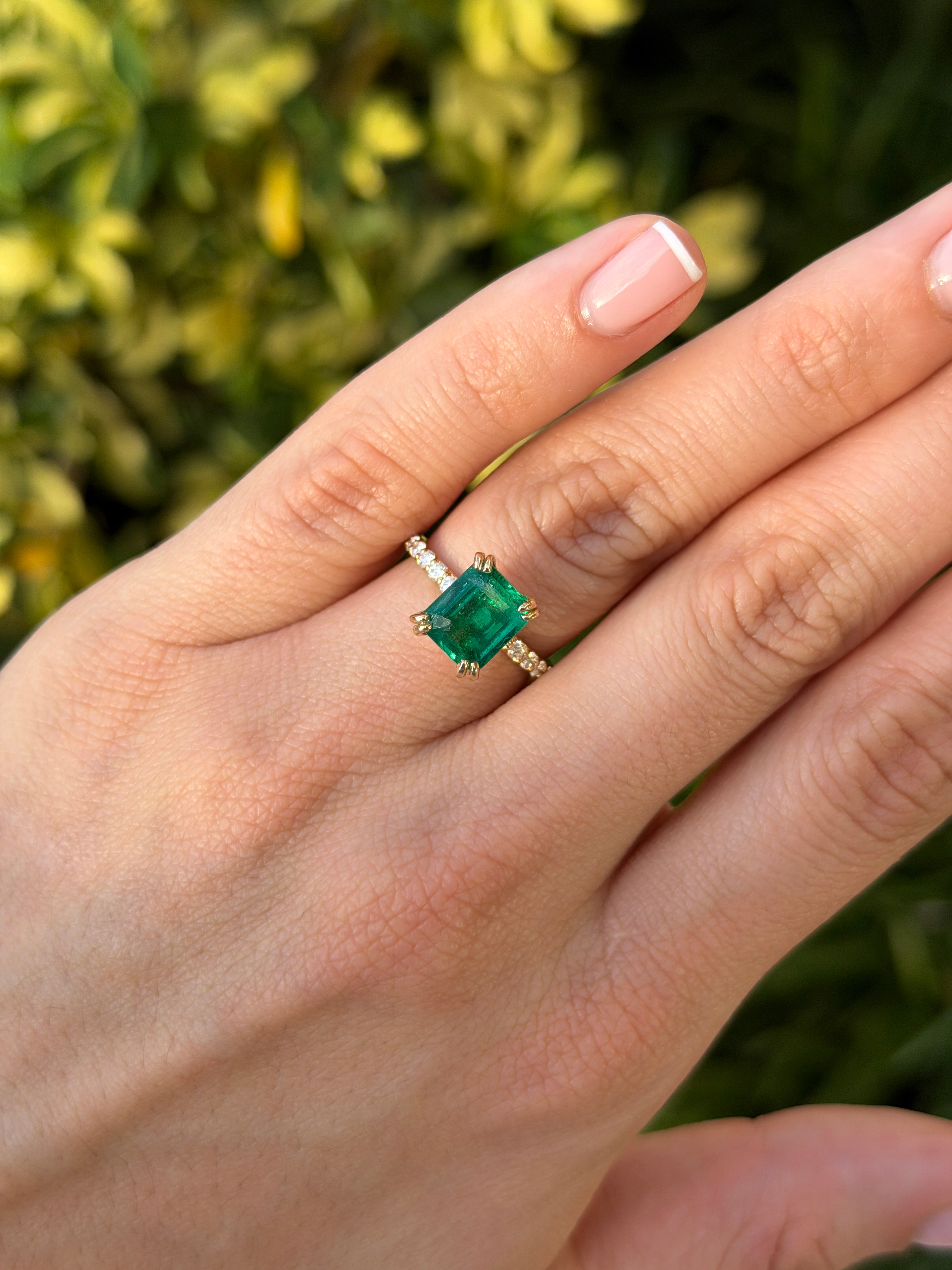 Double prong emerald solitaire engagement ring with diamond accents in 14K gold by JR Colombian Emeralds