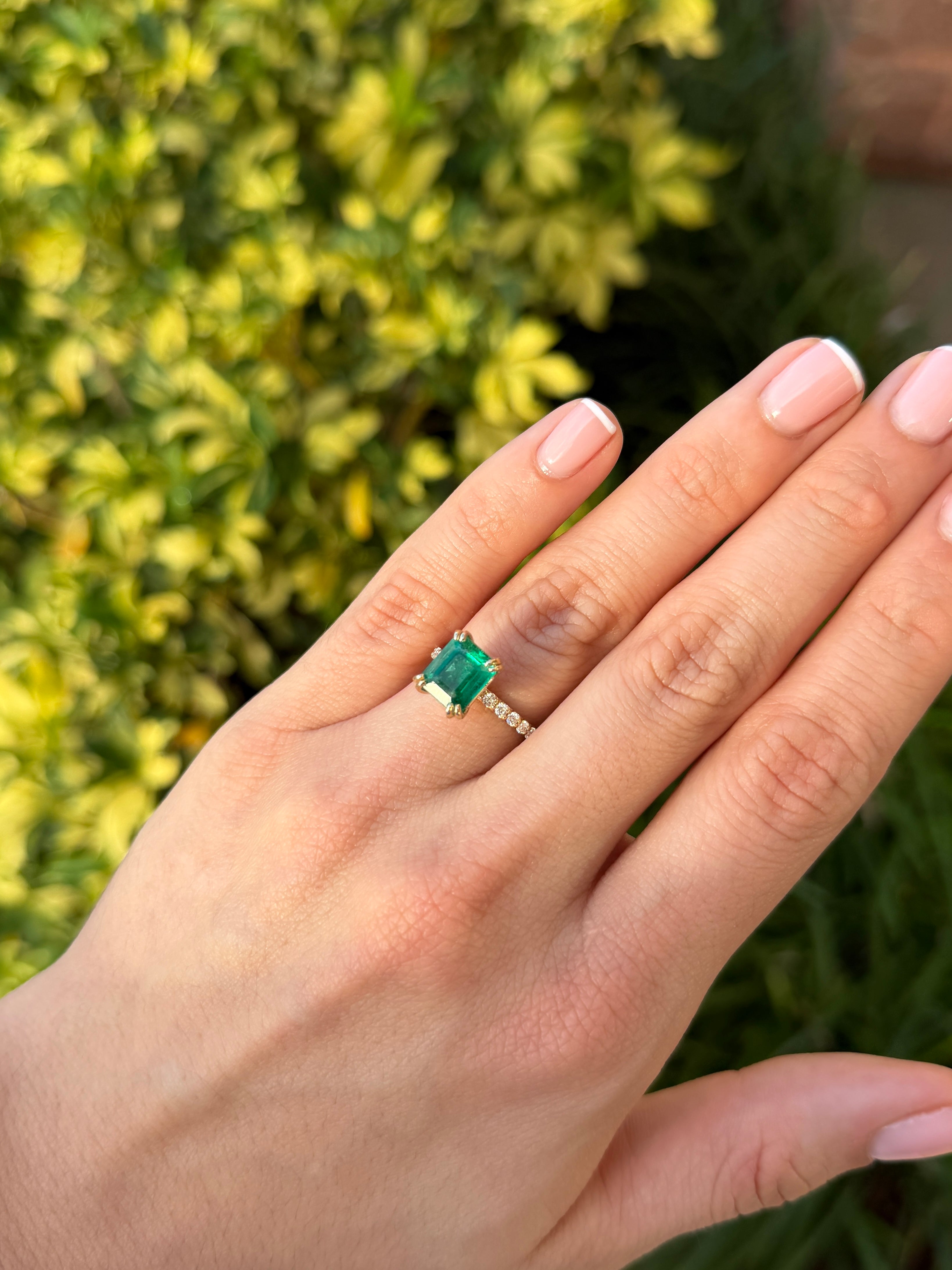 14K emerald solitaire engagement ring with double prong setting and diamond accents, by JR Colombian Emeralds
