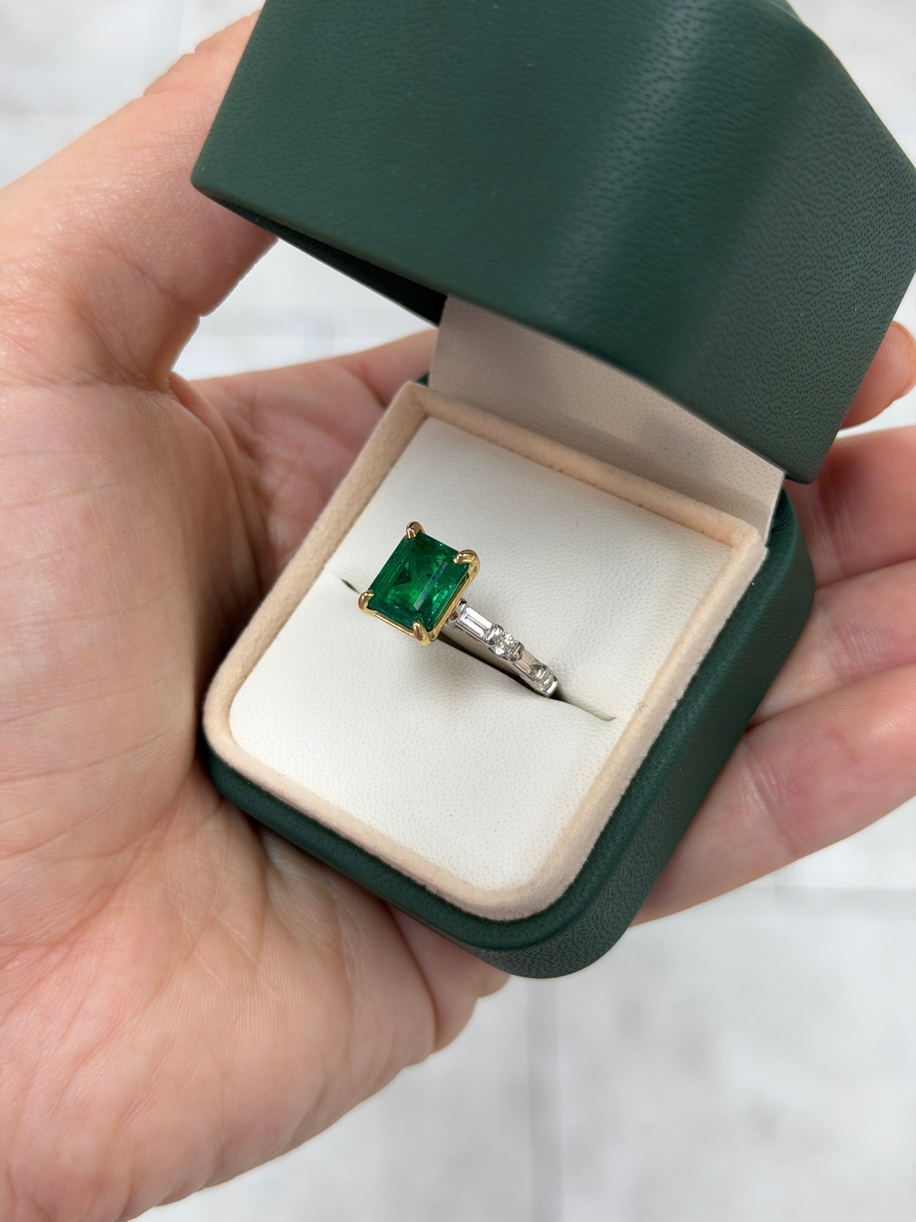 18K gold engagement ring with vivid natural emerald and platinum diamond baguette accents, featuring a 3.55tcw gemstone by JR Colombian Emeralds.