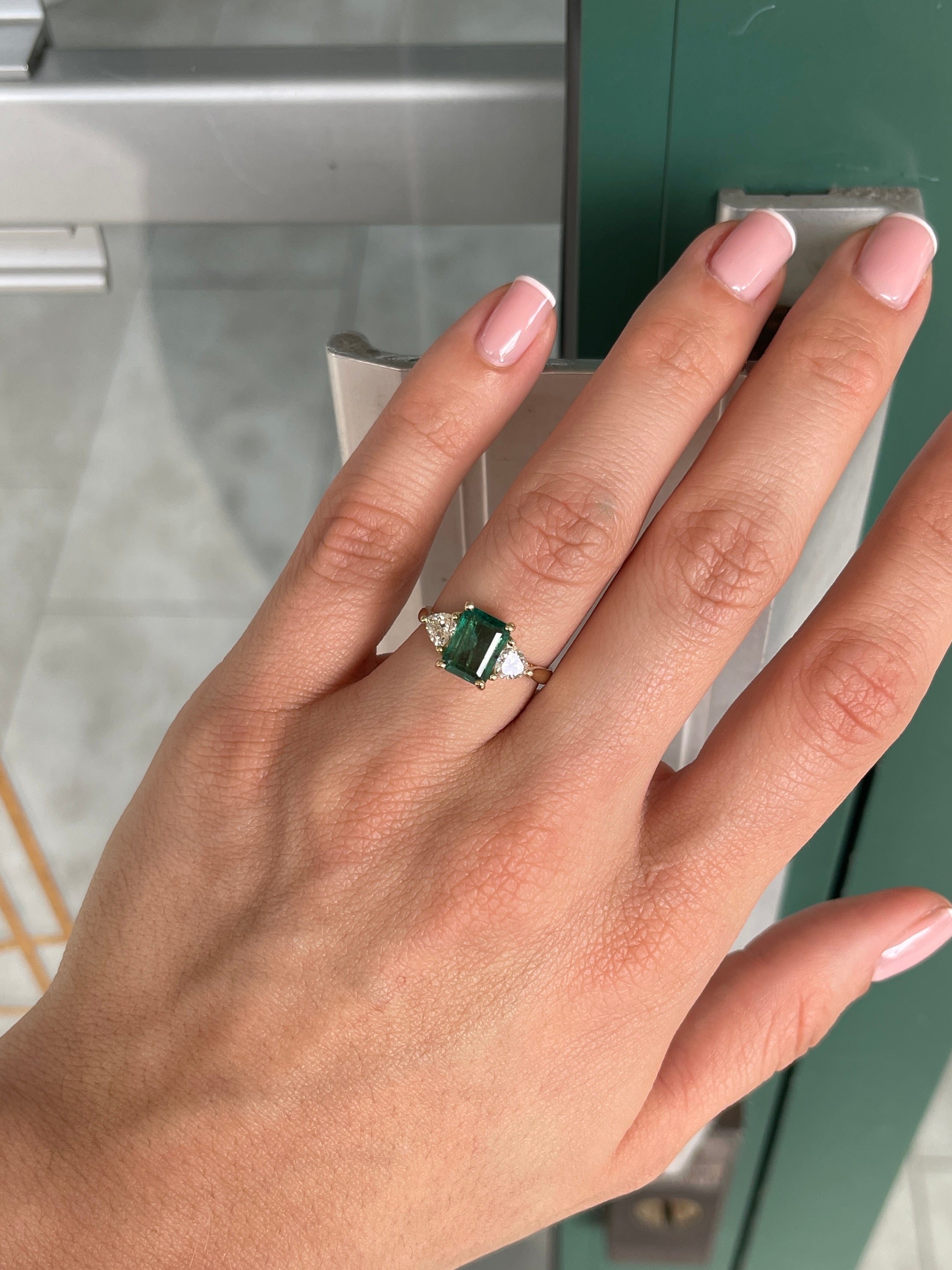 Natural emerald and lab diamond three-stone ring in 14K gold featuring trillion cut diamonds, by JR Colombian Emeralds.
