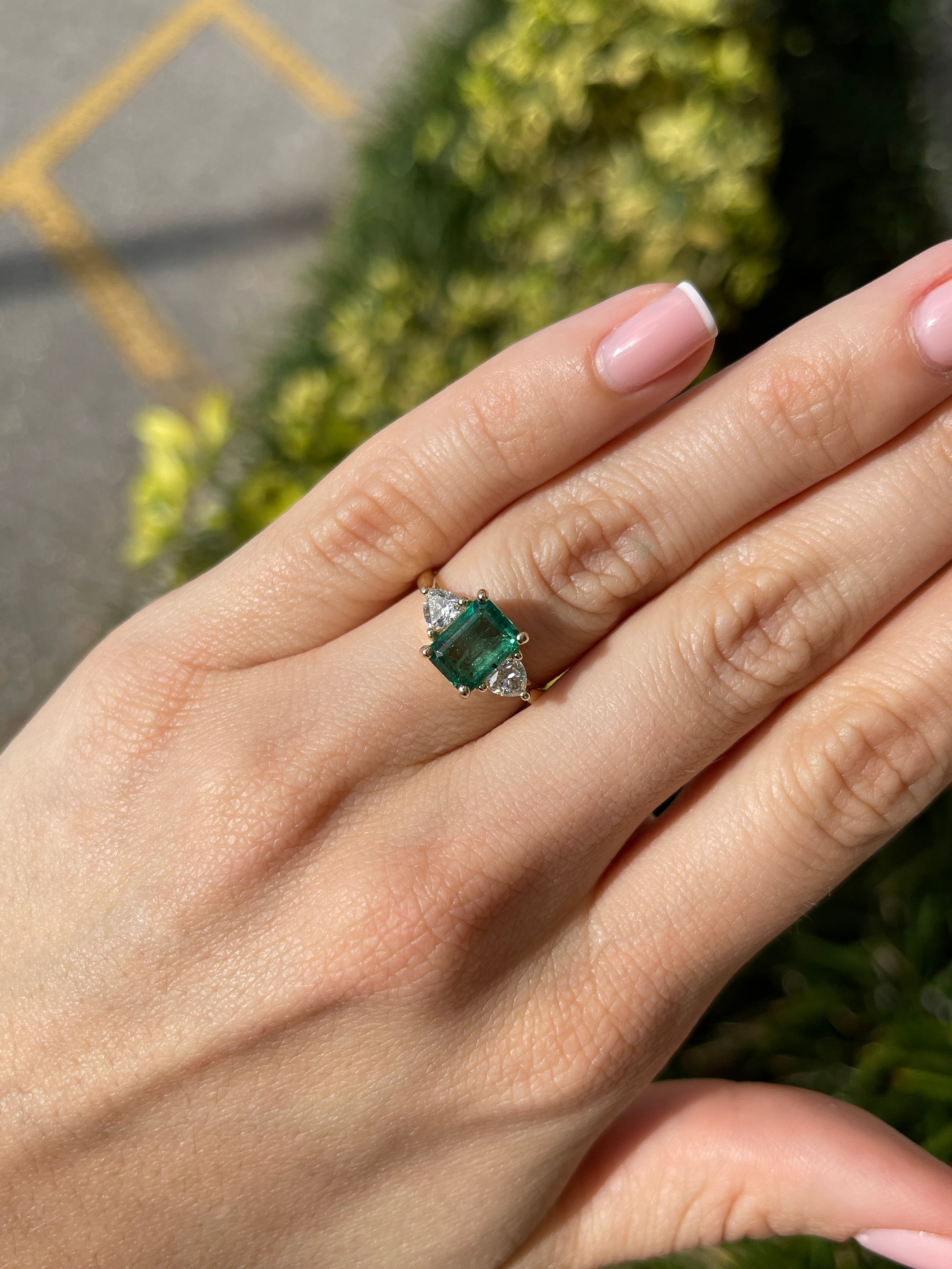 Natural emerald and lab diamond three stone ring in 14K gold, featuring trillion cut stones, by JR Colombian Emeralds.
