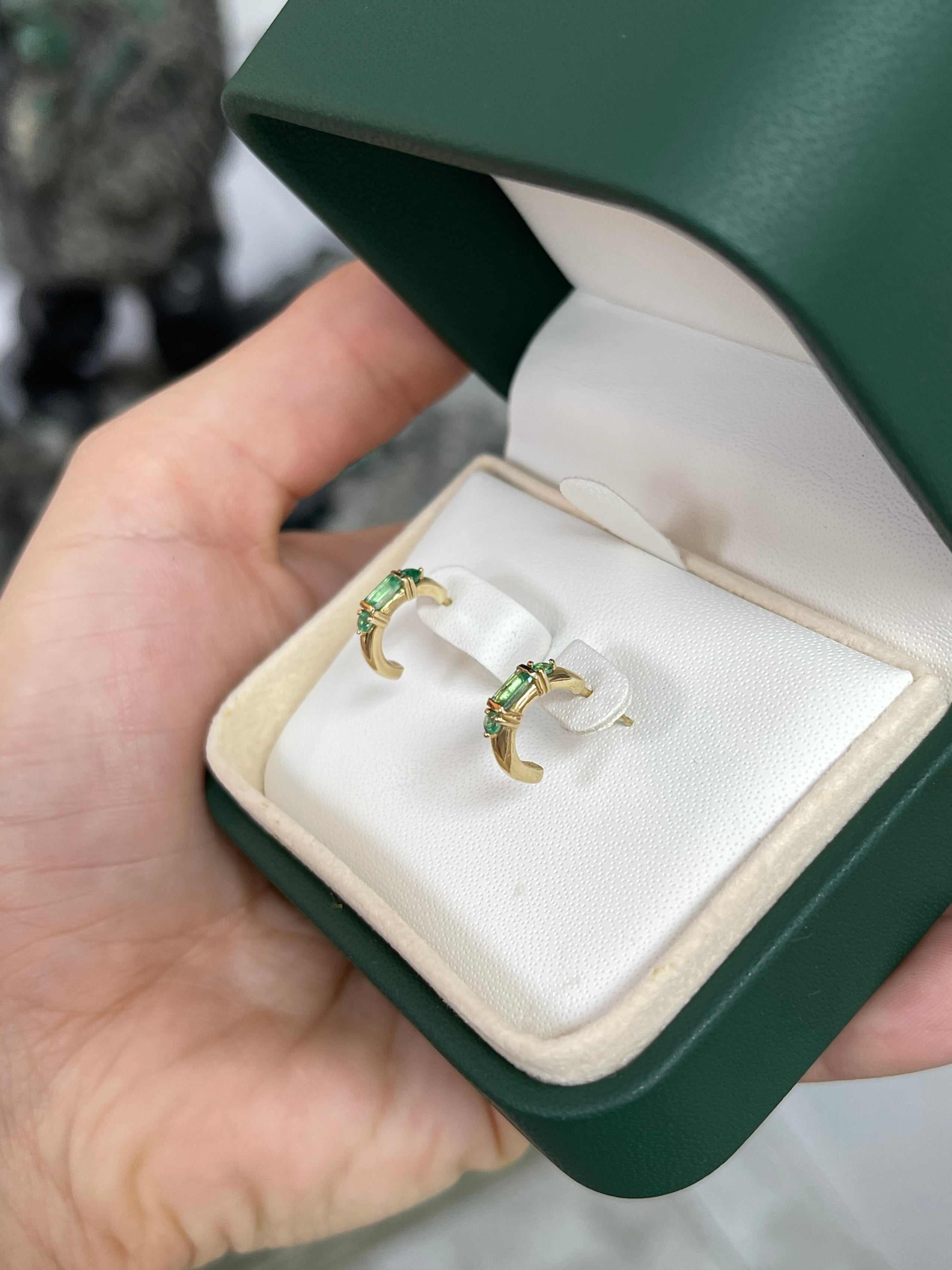 Petite 0.50ctw natural emerald half hoop earrings in 14K gold by JR Colombian Emeralds, showcasing elegant green gemstones.