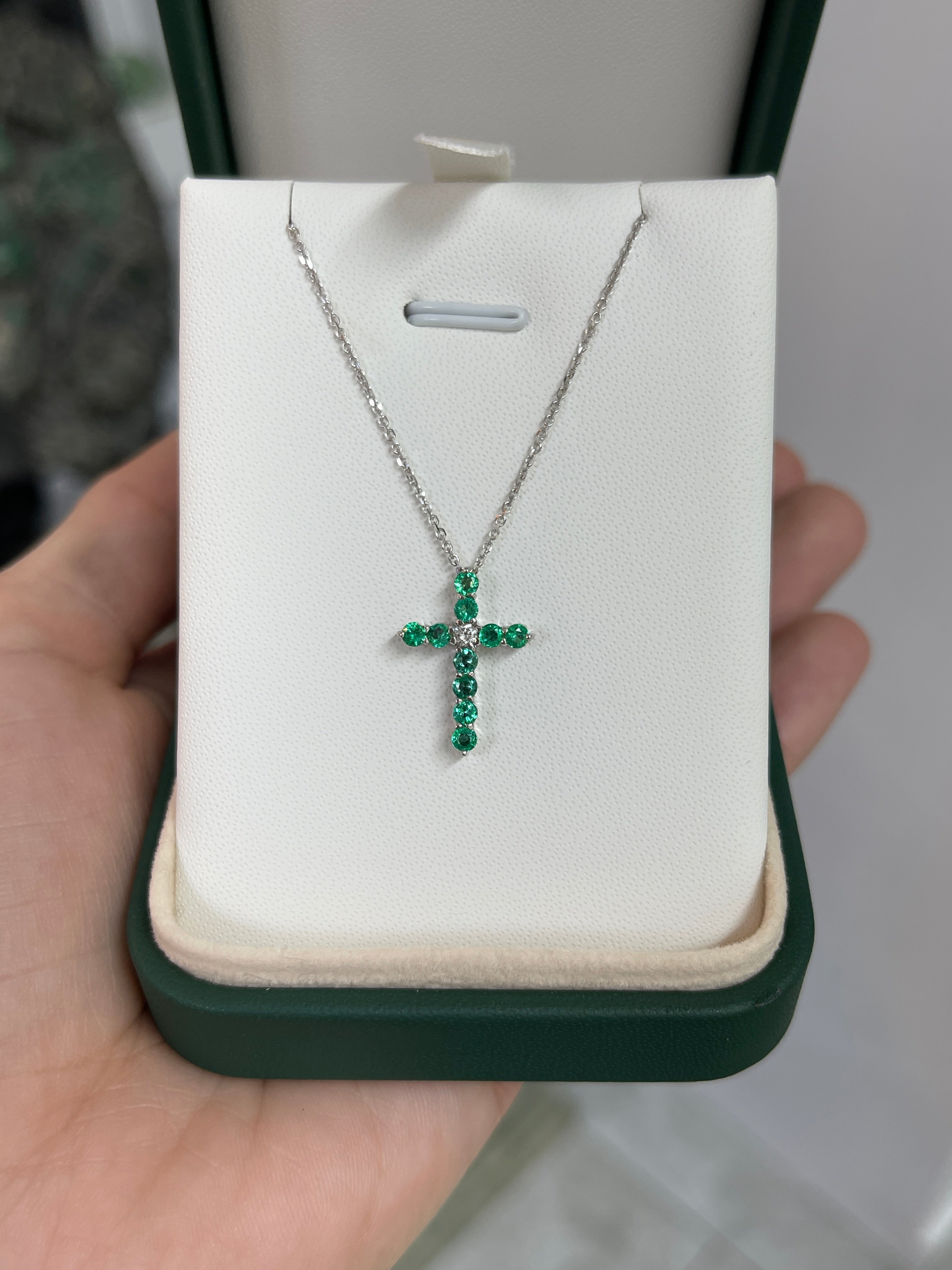 14K white gold cross necklace with 0.66ctw emerald and diamond accents, petite jewelry design by JR Colombian Emeralds.