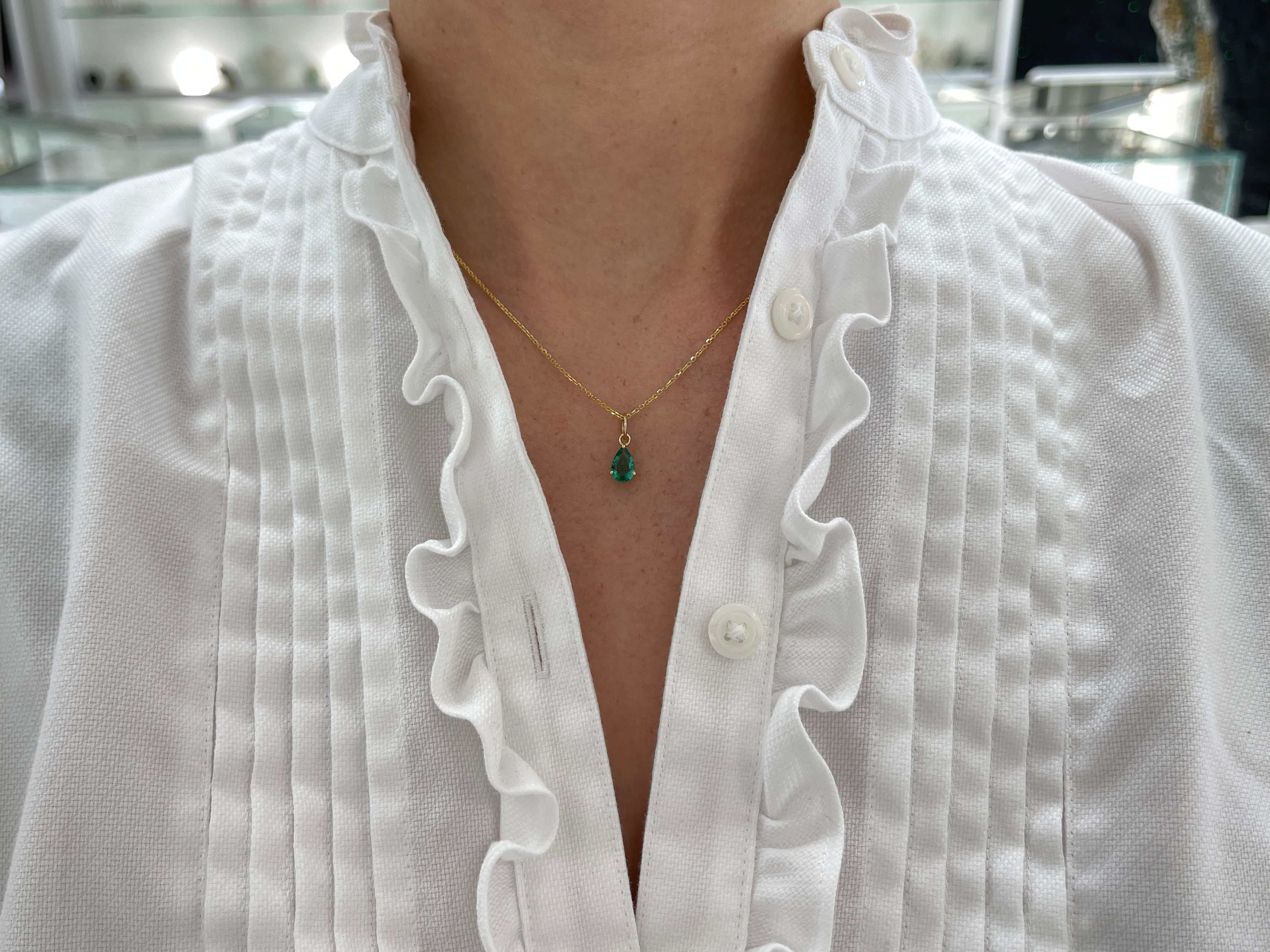 Petite 0.70ct natural freckled teardrop emerald pendant with 14K prong setting by JR Colombian Emeralds
