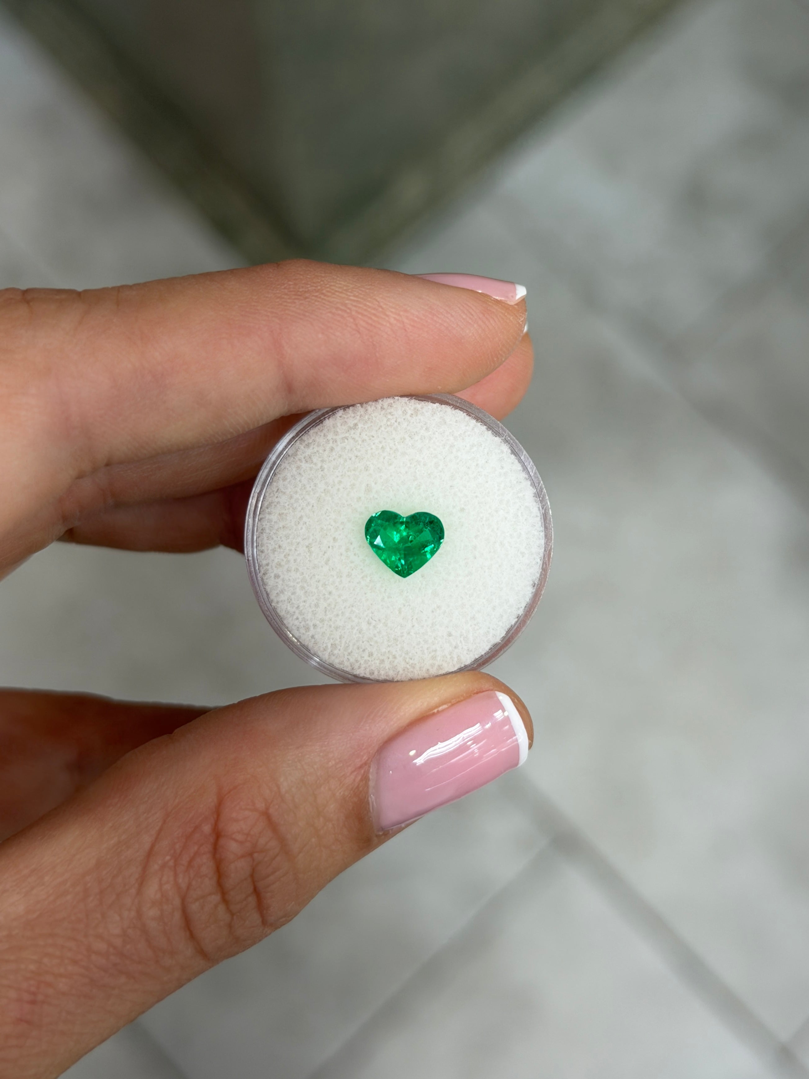 0.97 Carat AAA+ Muzo green Colombian emerald loose gemstone in heart cut, crystal-clear natural emerald from JR Colombian Emeralds.