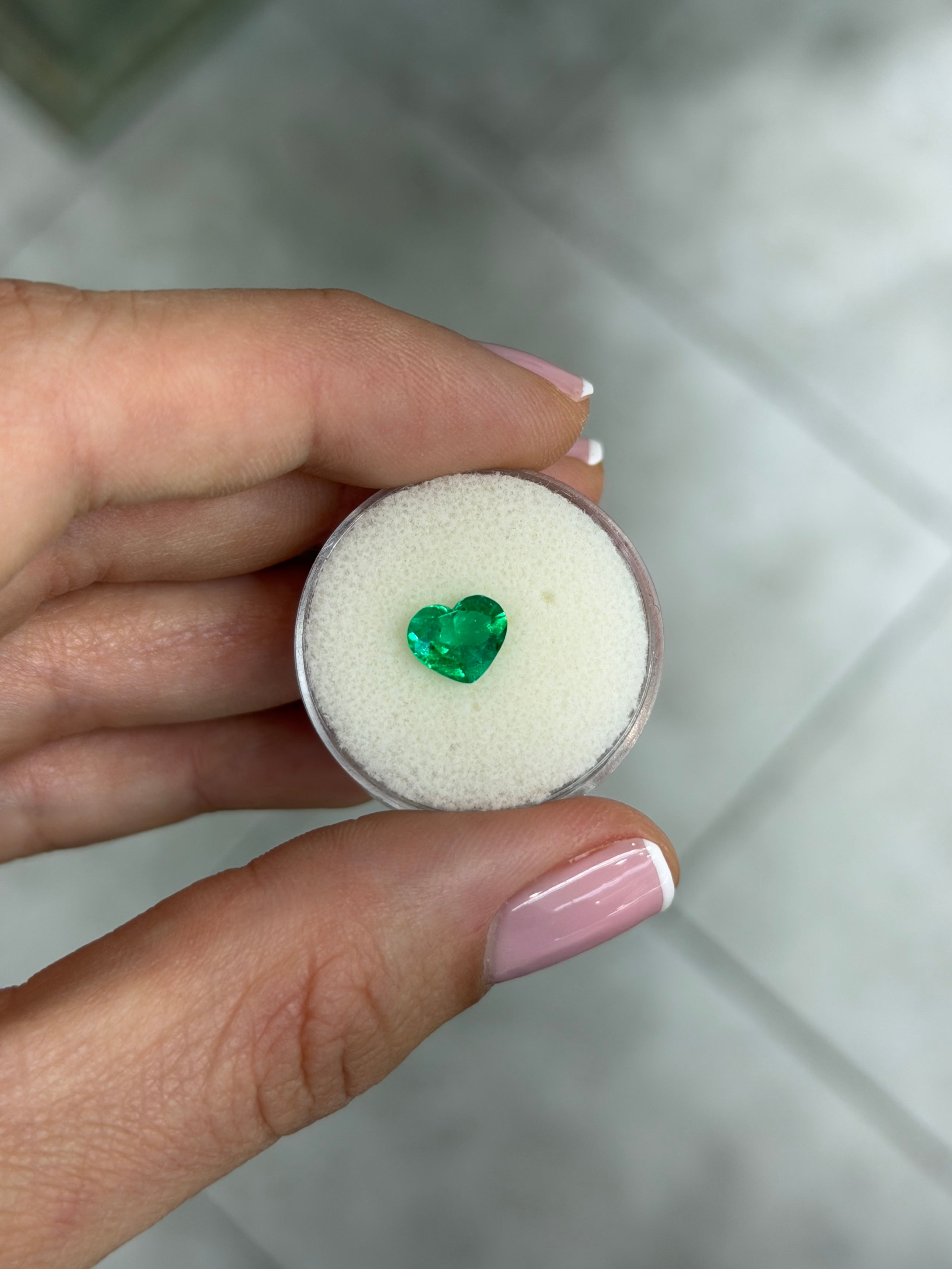 Natural 1.08 carat AAA+ Colombian emerald loose stone with heart cut, vibrant Muzo green, from JR Colombian Emeralds.