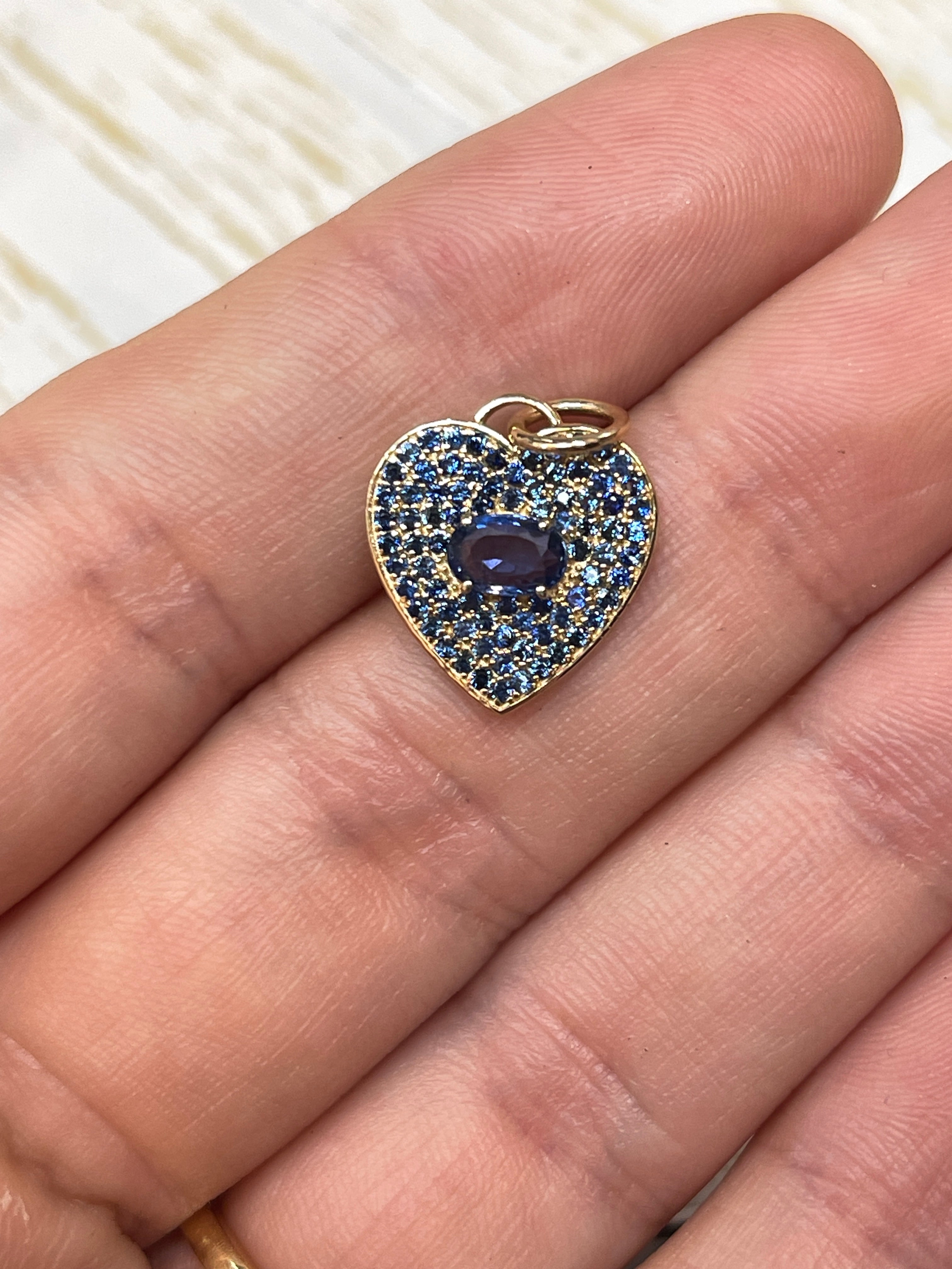 14K blue sapphire heart charm pendant with 1.10 carats from JR Colombian Emeralds, featuring a detailed heart design.