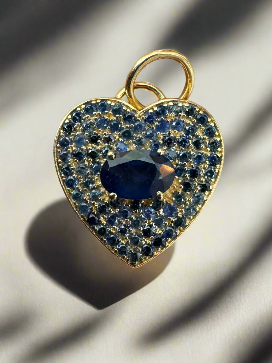 14K gold blue sapphire heart charm pendant with 1.10 carats, featuring a sparkling heart-shaped gemstone from JR Colombian Emeralds.