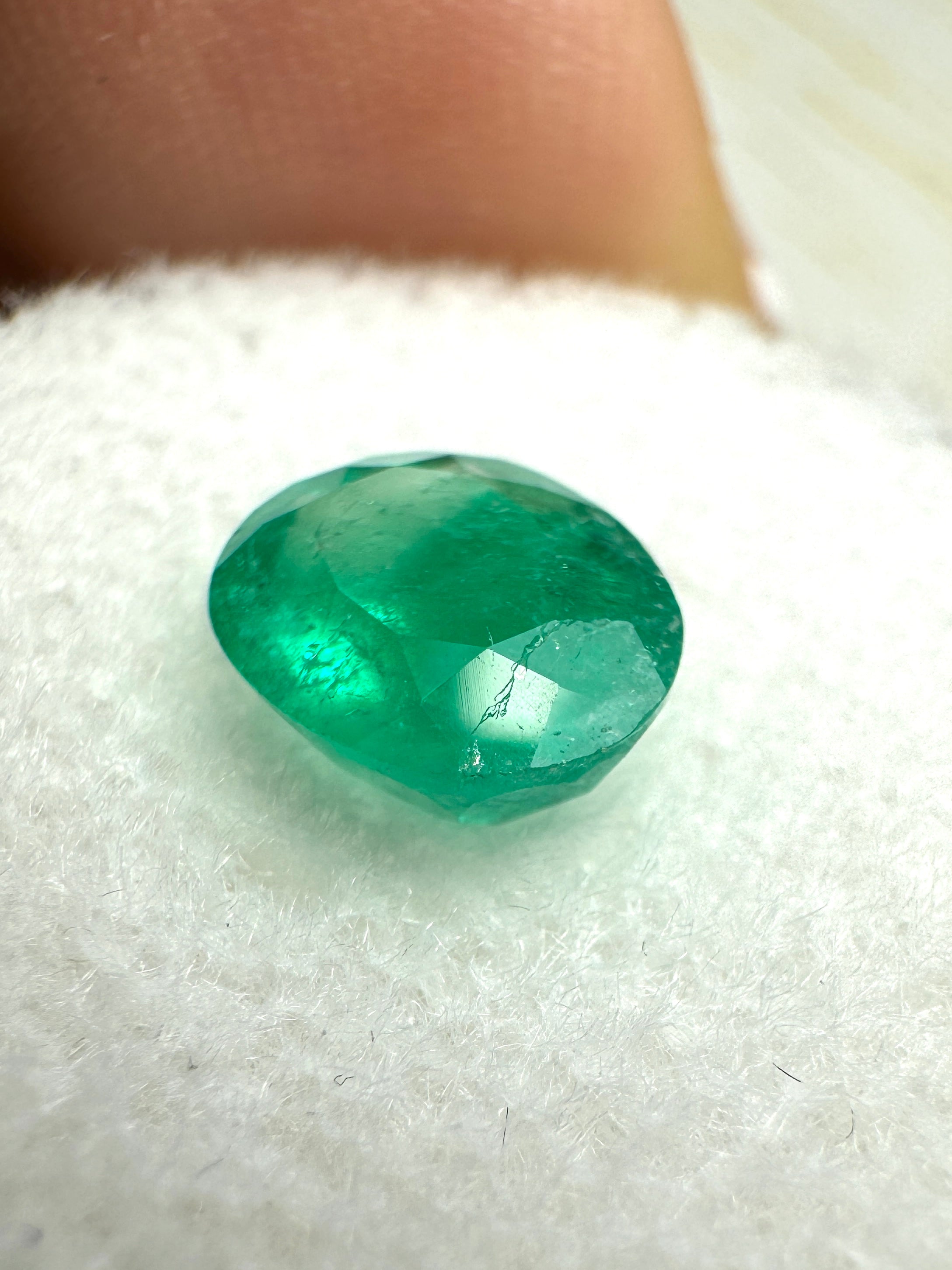 Oval cut 1.19 carat semi-transparent rich green Colombian emerald loose gemstone by JR Colombian Emeralds.