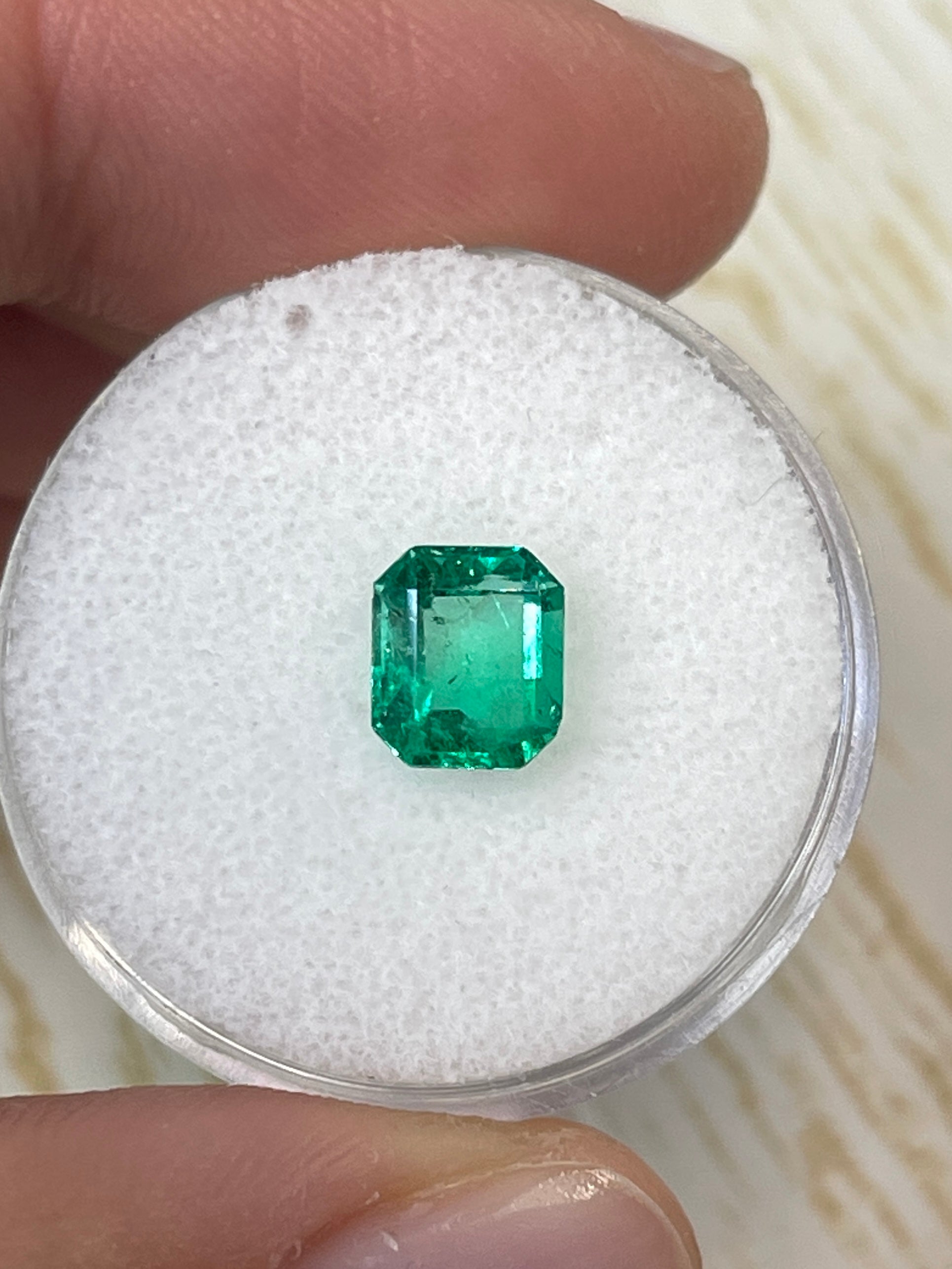 1.20 carat yellowish green natural Colombian emerald in emerald cut, loose gemstone from JR Colombian Emeralds.